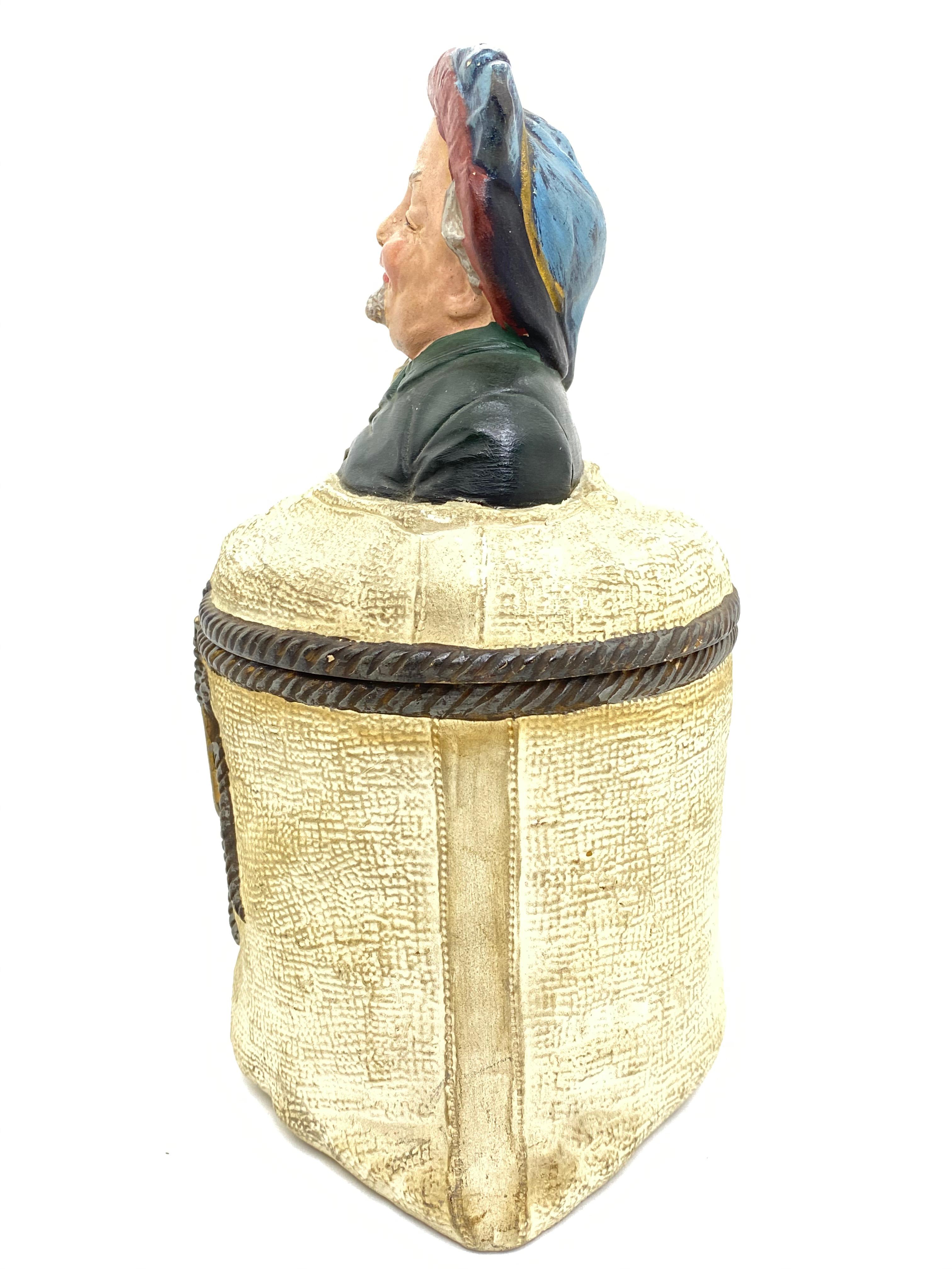 This offer is for one of our rare Majolica items, an exceptional tobacco box out of the sack series by Johann Maresch from the beginning of the 20th century. The beautiful worked Majolica box shows a flour bag with a Noble man sitting in it, who