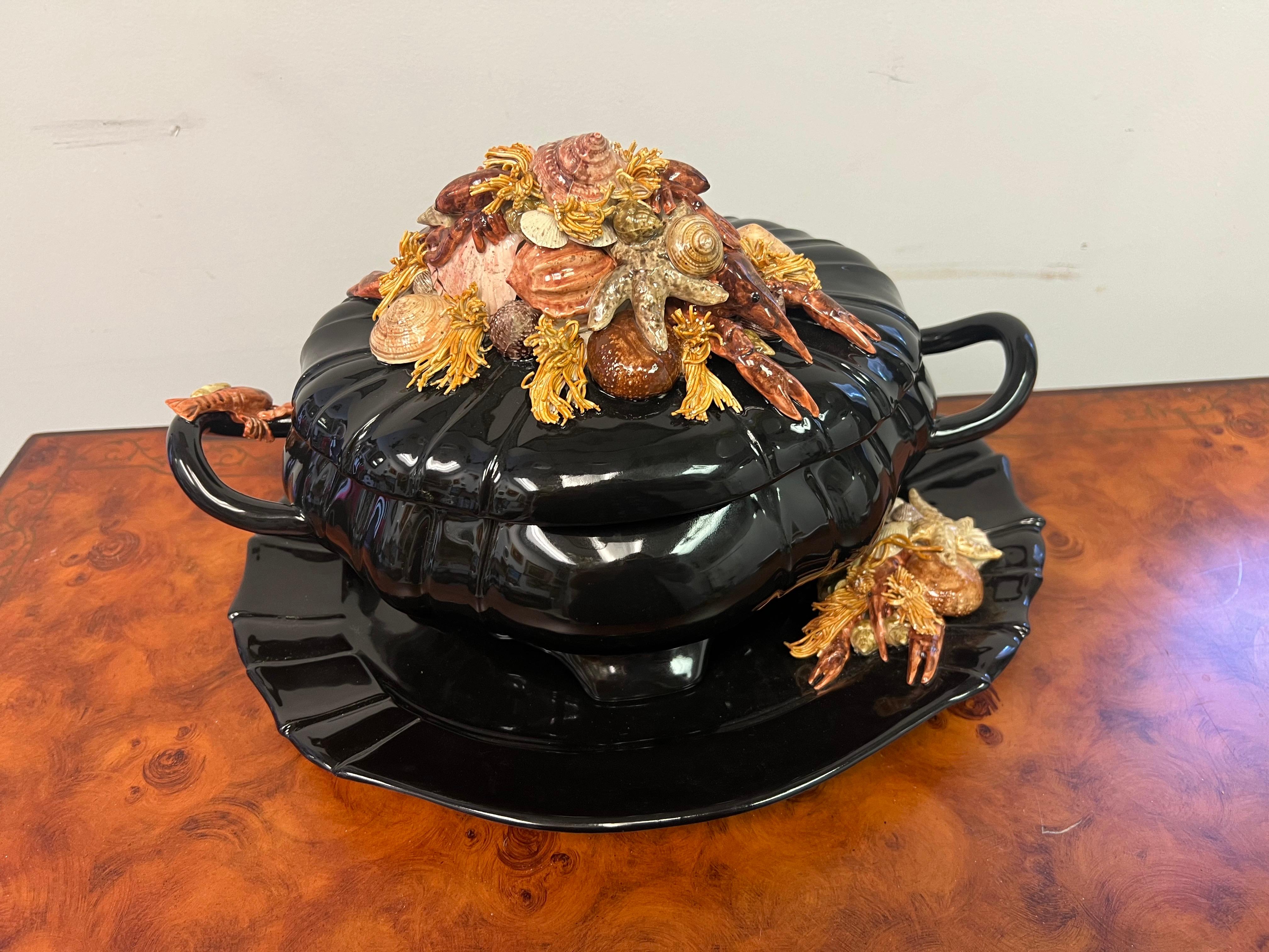 An absolutely fantastic ceramic serving dish encrusted with hand painted shellfish tureen.  Everything from the platter to the handle, and most importantly the top is just stunning with lobster, crawfish, clams, starfish, and more!   The unexpected