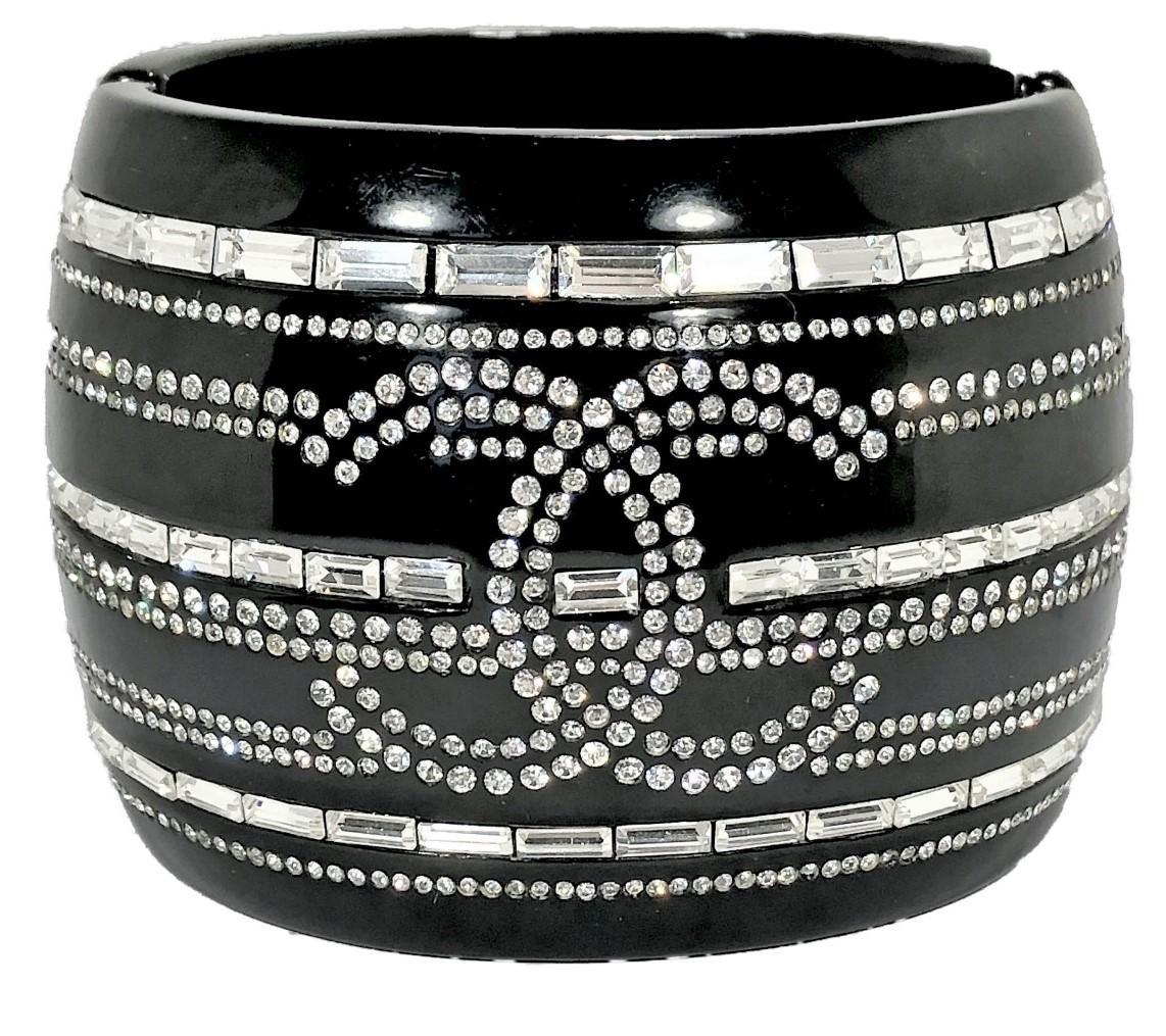 This important Chanel black resin and rhinestone cuff was released as part of the 2009 cruise collection.  It is in excellent vintage condition and is simply stunning. What a wonderful item to show off in.  It gives new meaning to the phrase 