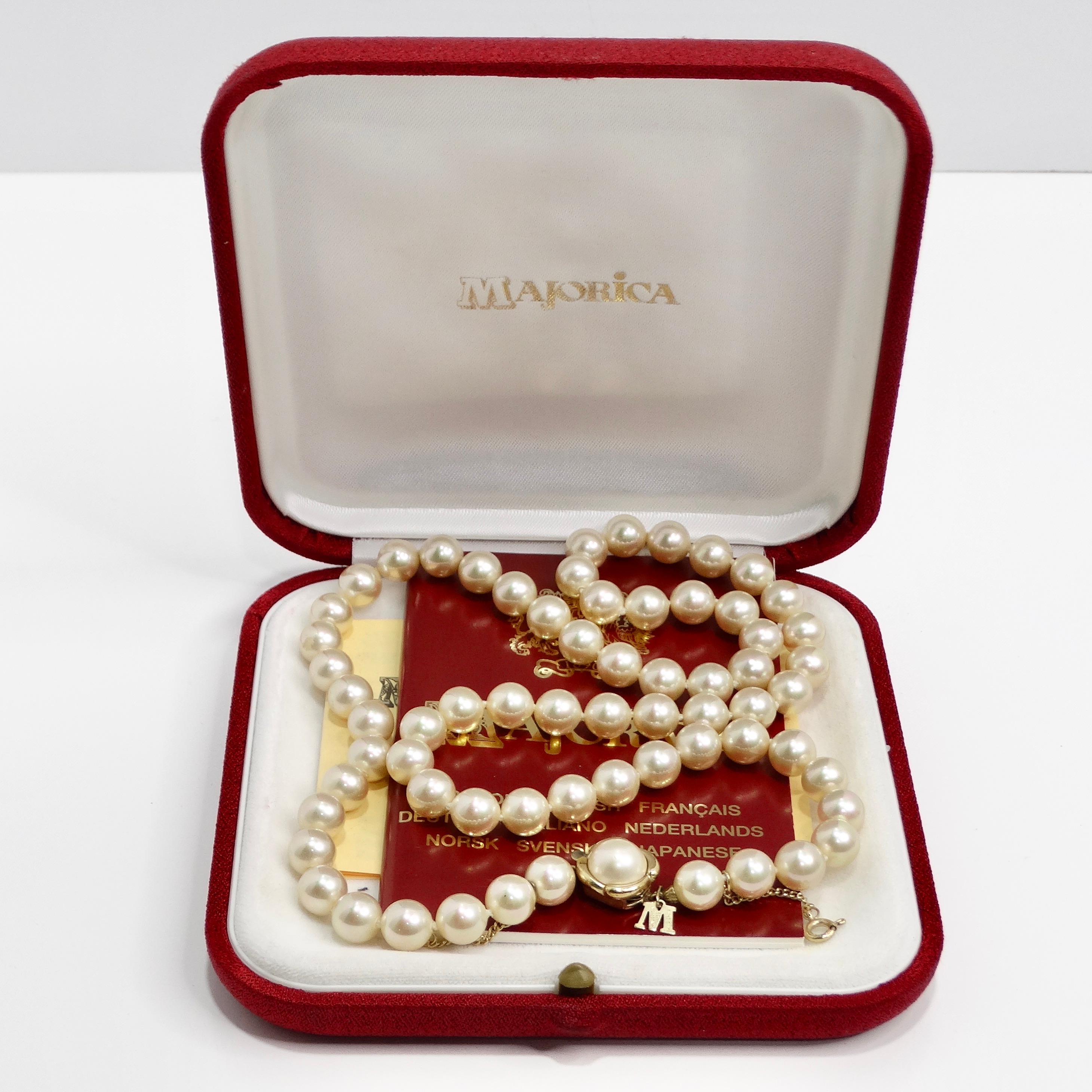Introducing the Majorca 1980s Silver Pearl Necklace, a vintage classic that exudes timeless elegance and sophistication. This exquisite necklace features lustrous white pearls, renowned for their uniform shape and smooth surface, providing a touch