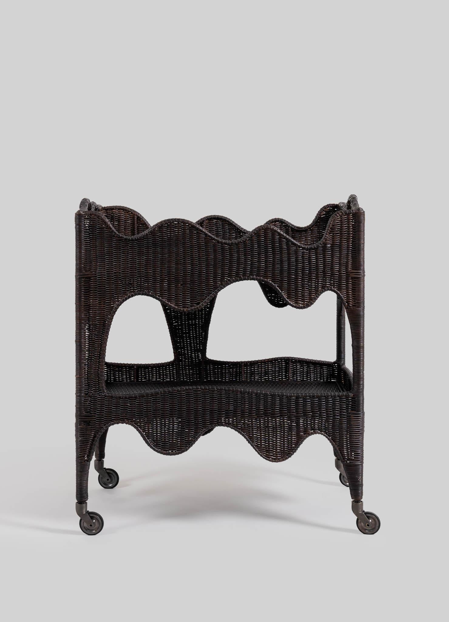 Majuli Bronze Cane Trolley, Viya by Vikram Goyal

Sinuous forms in a captivating rhythm of deftly woven cane, evoke the dynamic flow of Assam's rivers. The collection’s namesake, the river island Majuli, becomes the source of inspiration for its