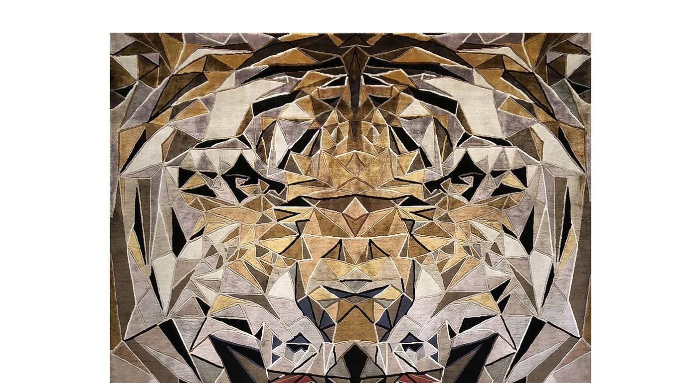 A spectacular rendition of the head of a tiger, depicted while roaring at the viewer and rendered using geometric elements, is the stunning decoration of this rug is part of the exclusive Limited Edition Collection. This bold piece is hand knotted