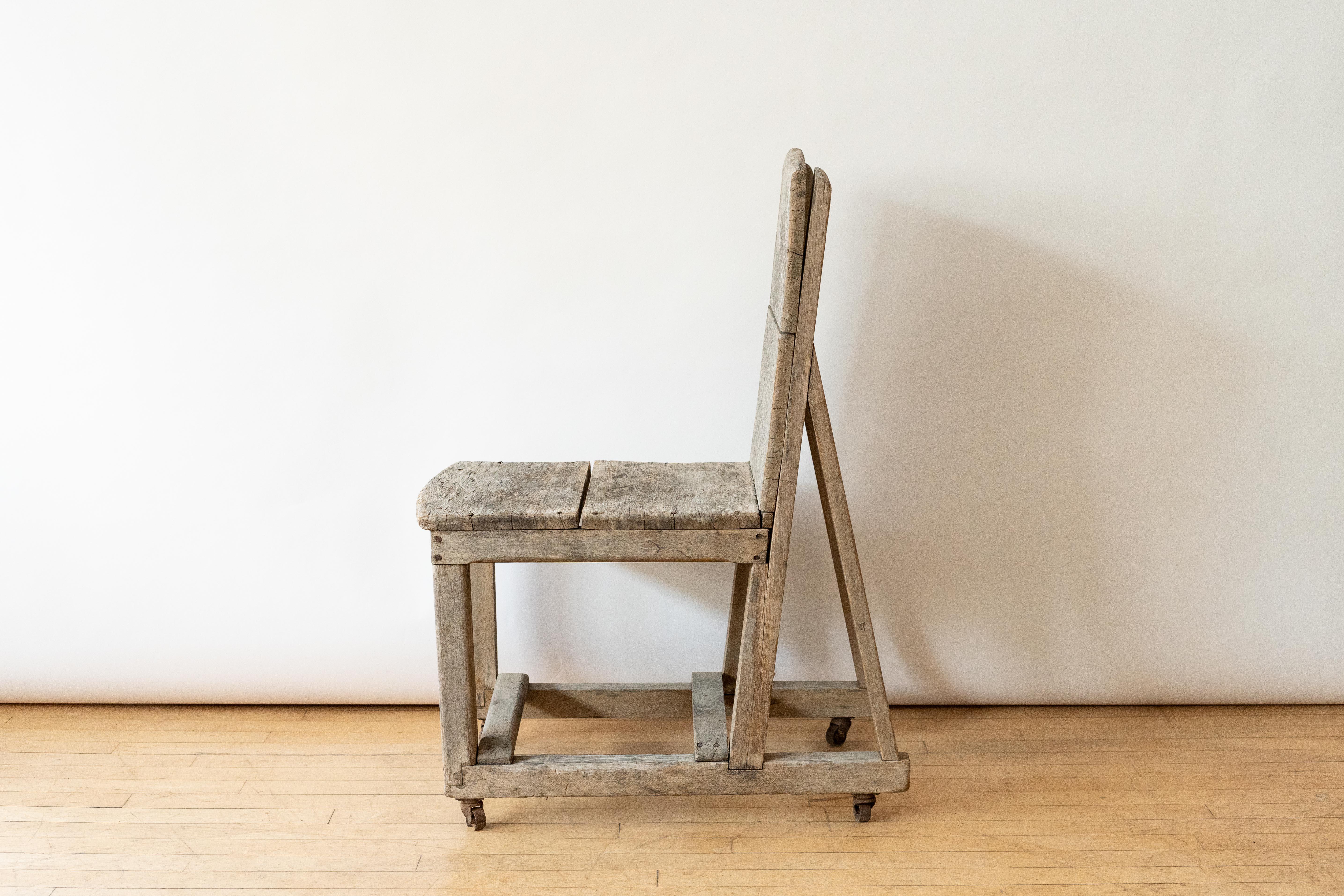USA, ca. 1930s or 1940s. A pitched machinist’s chair with striking Constructivist look. Features handmade wood scaffold construction supported by original casters. While we do not know this object’s true function, its rugged, geometric design