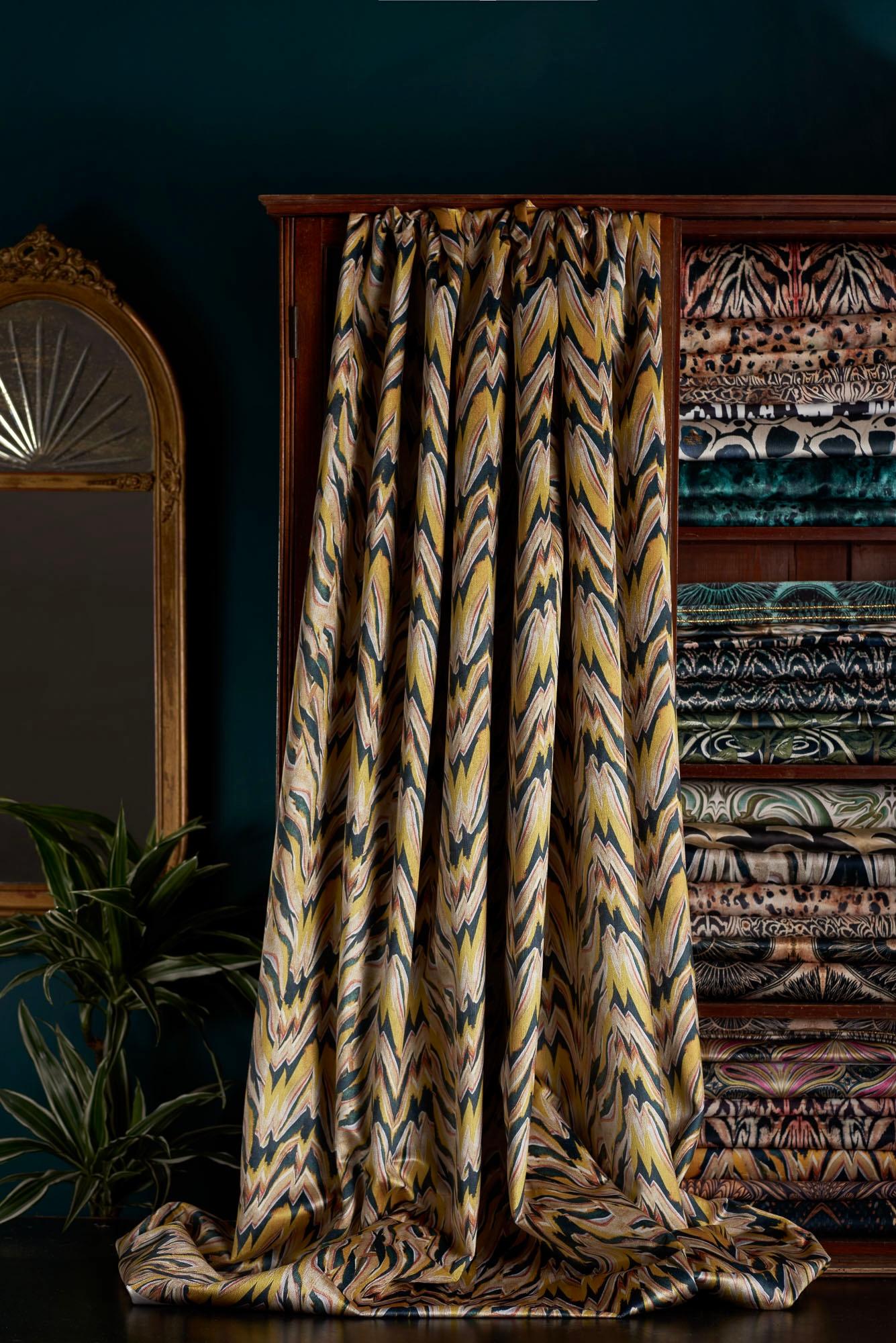 Our take on a tiger print – Makemba design available as fabric for your project. A bold and distinctive design in yellows orange teal and black.

This velvet is midweight, with a strong straight woven backing, so is suitable for upholstery, but is
