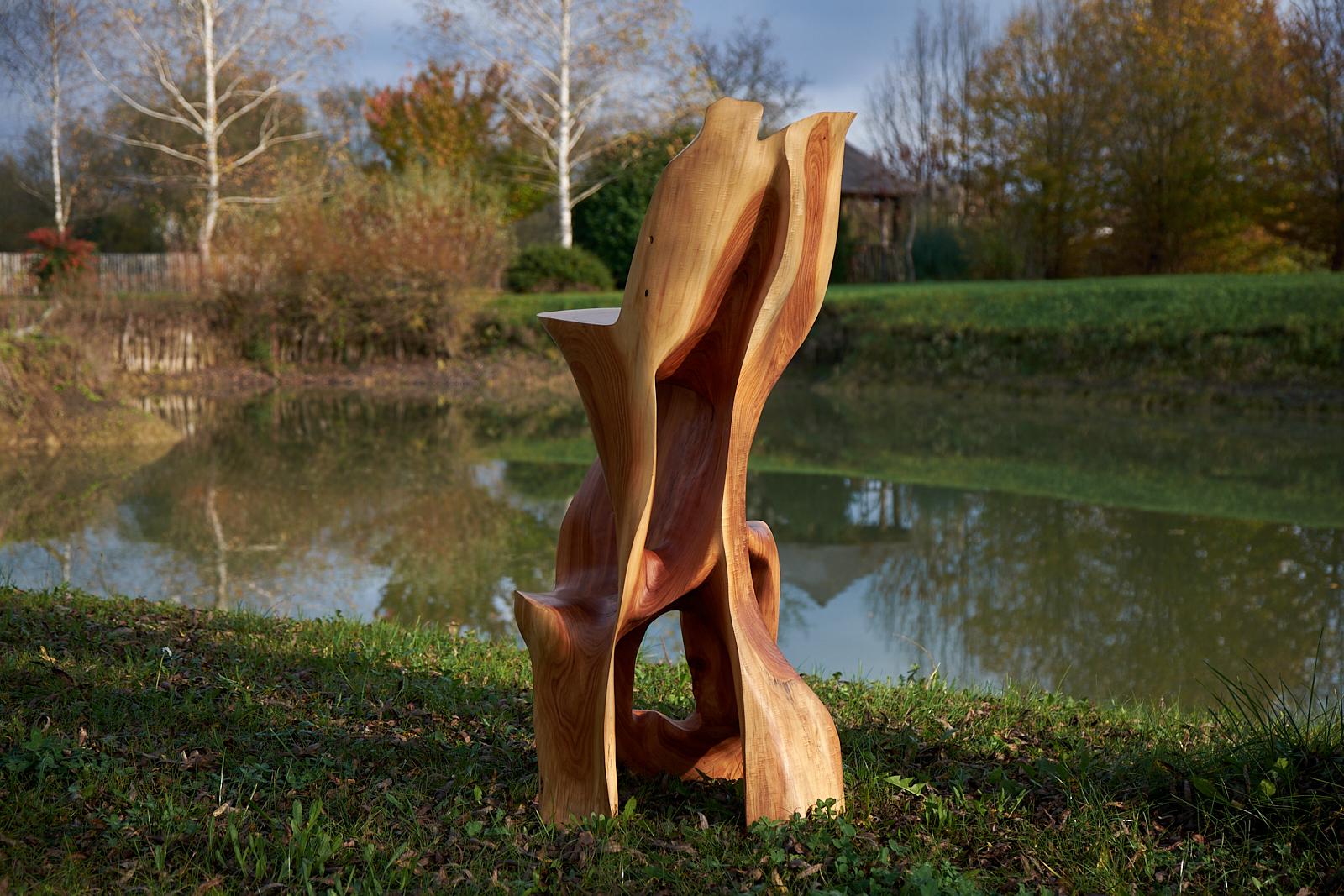 Unique chainsaw carved wooden functional sculpture usable as a bar chair. Carved from a single piece of wood and protected with the highest quality oils, ensuring durability for generations. Such unique handmade design will highlight your interior