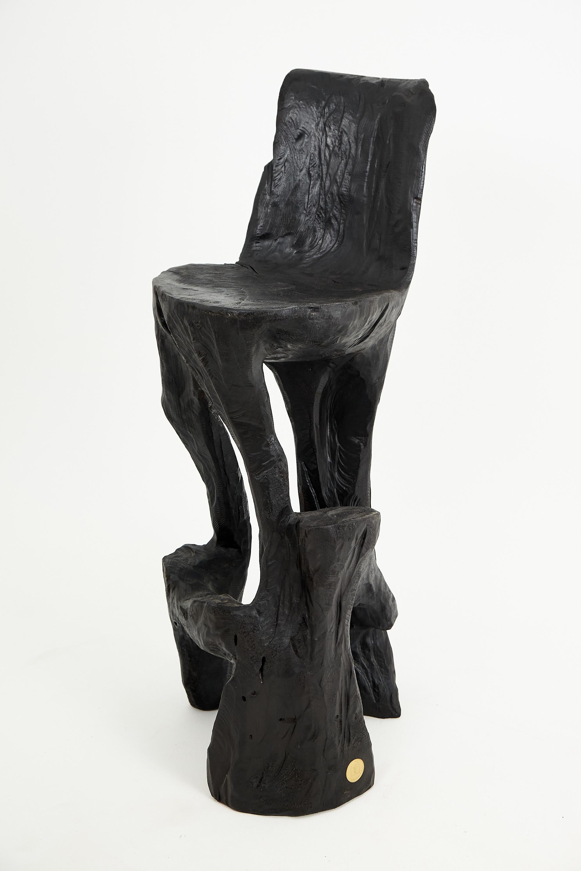 Unique chainsaw carved wooden functional sculpture usable as a bar chair. Carved from a single piece of wood and protected with the highest quality oils, ensuring durability for generations. Such unique handmade design will highlight your interior