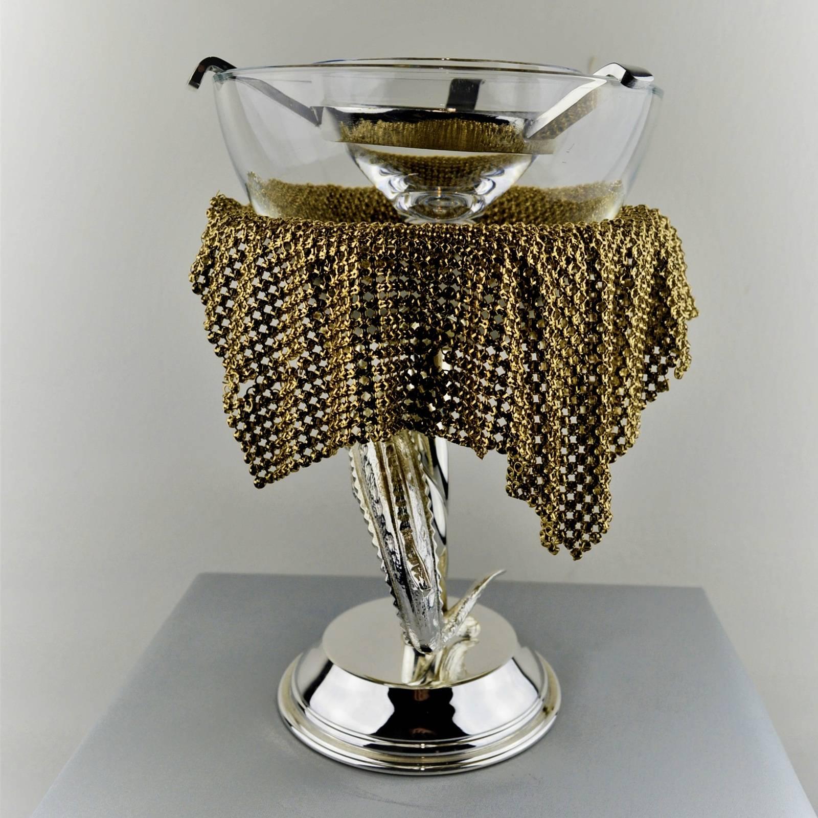This stunning serving goblet is a celebration of exquisite craftsmanship and traditional decor. It is designed to serve caviar, thanks to its upper small cup, equipped with a small metal spoon, resting inside a larger one to be filled with chipped