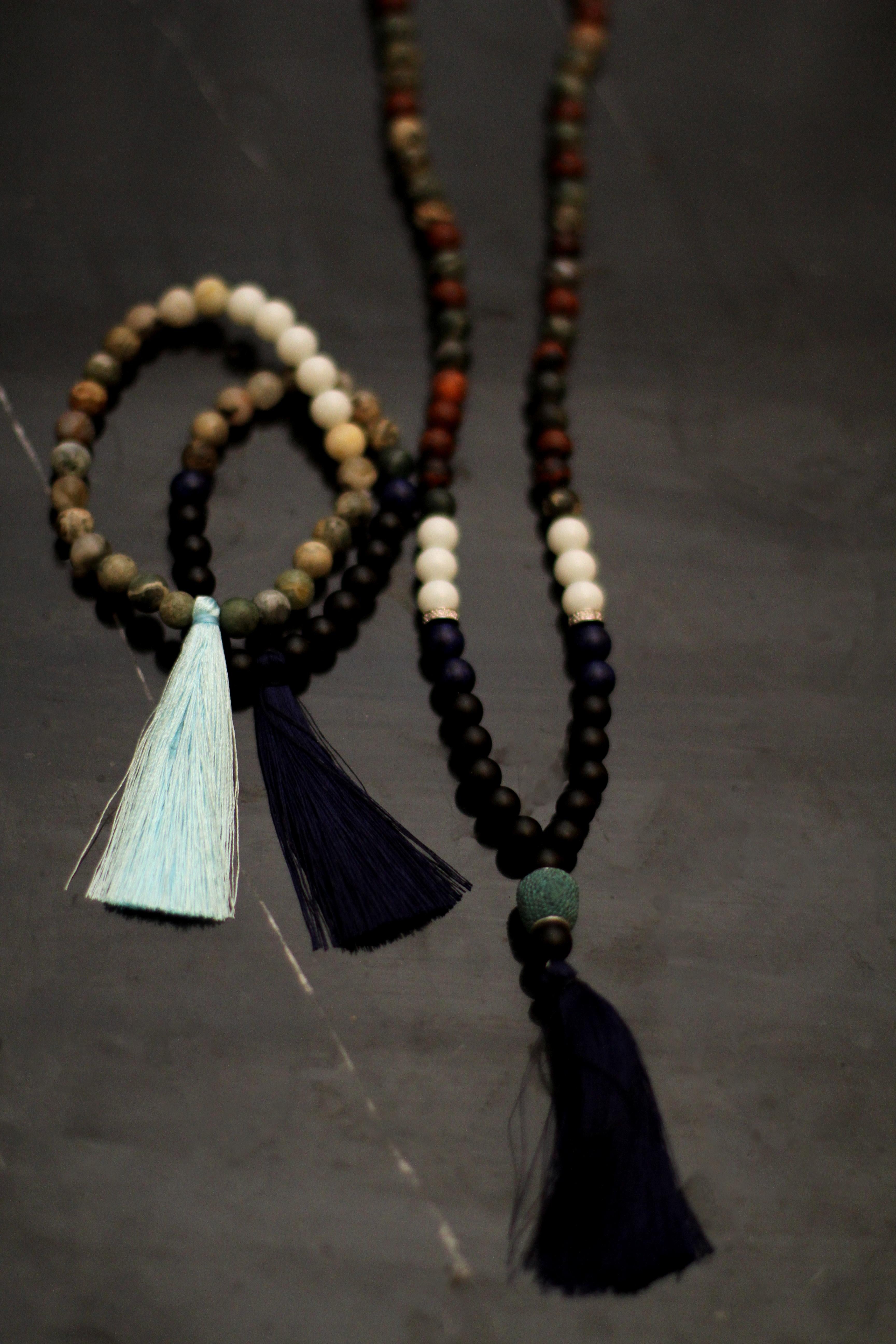 This Mala necklace is made of matt lapis lazuli, opal and matt grey agate. It is incrusted with 18 karat white gold beads with diamonds (top F/G, SI). It has a dark blue brush. It has traditional 108 8 mm beads, and 5 extra different size beads.