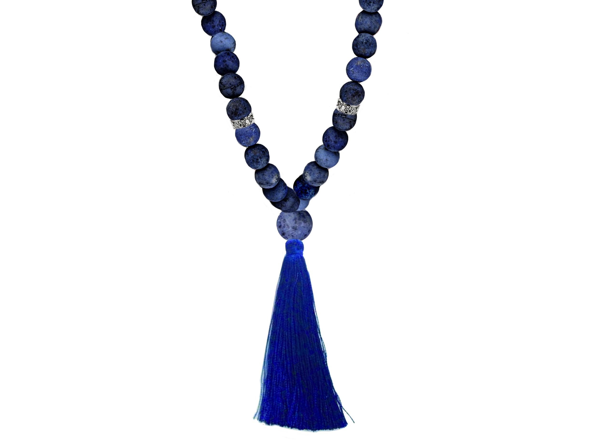 This Mala necklace is made of dark matt lapis lazuli, black onyx, matching dumortierite, Tahitian pearls, and matt poppy jasper. It is incrusted with 18 karat white gold beads with diamonds (top F/G, SI). It has a silky dark blue brush. It has
