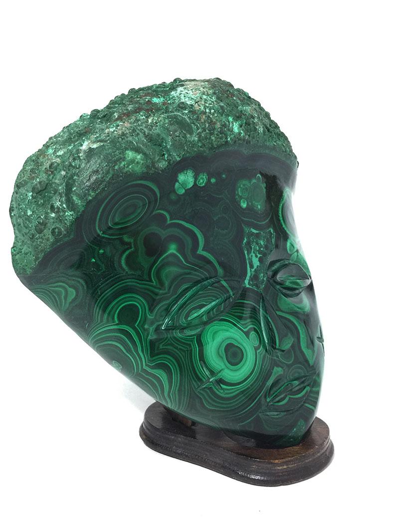 Malachite African wall decoration mask

Large malachite face figure for decoration on the wall
Africa, 1970s
Standard not included
In the face above the lips a small scratch, see detail in the pictures

The measurements are 18.5 cm high, 17