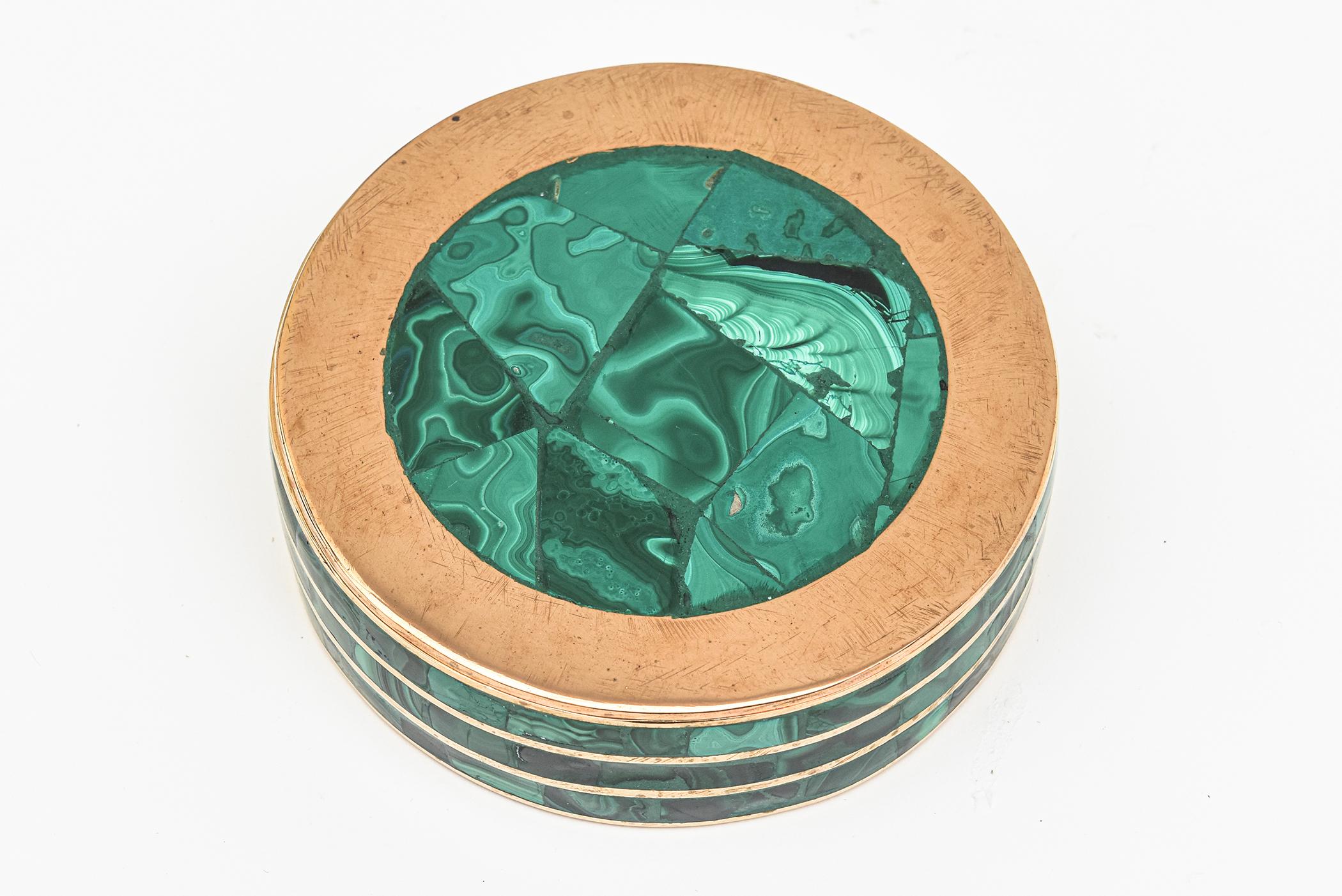 This lovely and substantial malachite and bronze vintage box is 2 parts. The bronze embedded lines form the perimeter set against the malachite. This makes a great desk accessory and is very rich looking. It is from the 1960s. it has good weight to