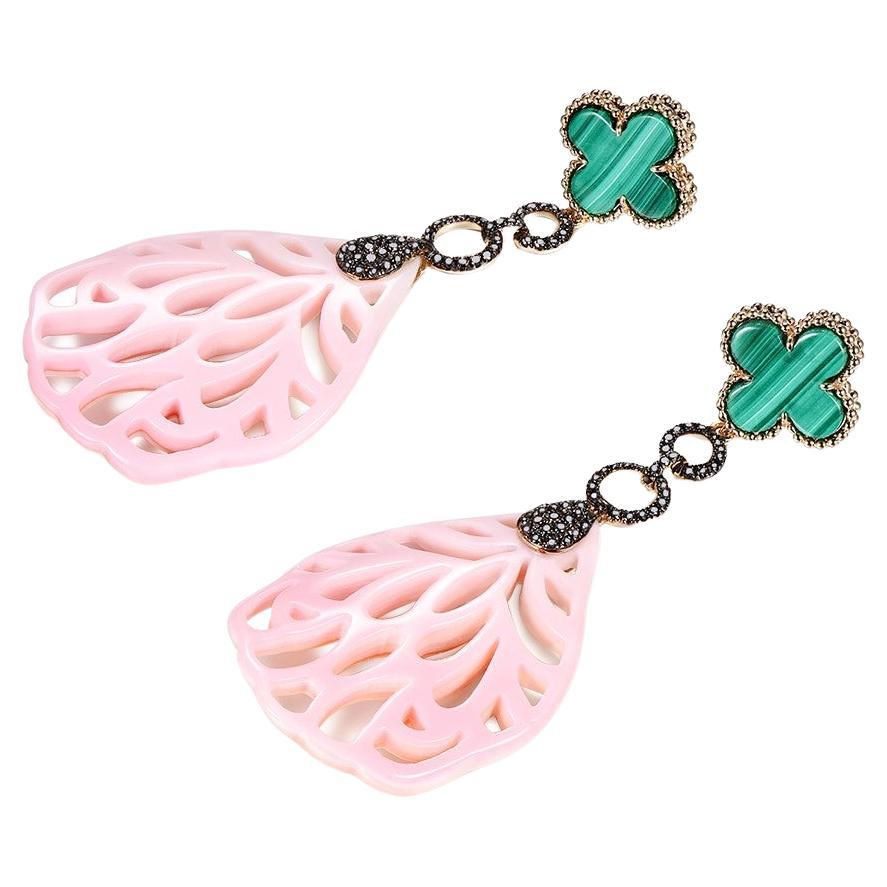 This earrings feature a four clover malachite at the top, the gold link below is set with black diamonds attached to a pink shell. Earrings are set in 14 karat yellow gold. 

Length 63 mm
Width 25 mm

Malachite 5.83 carat
Pink Shell 26.68