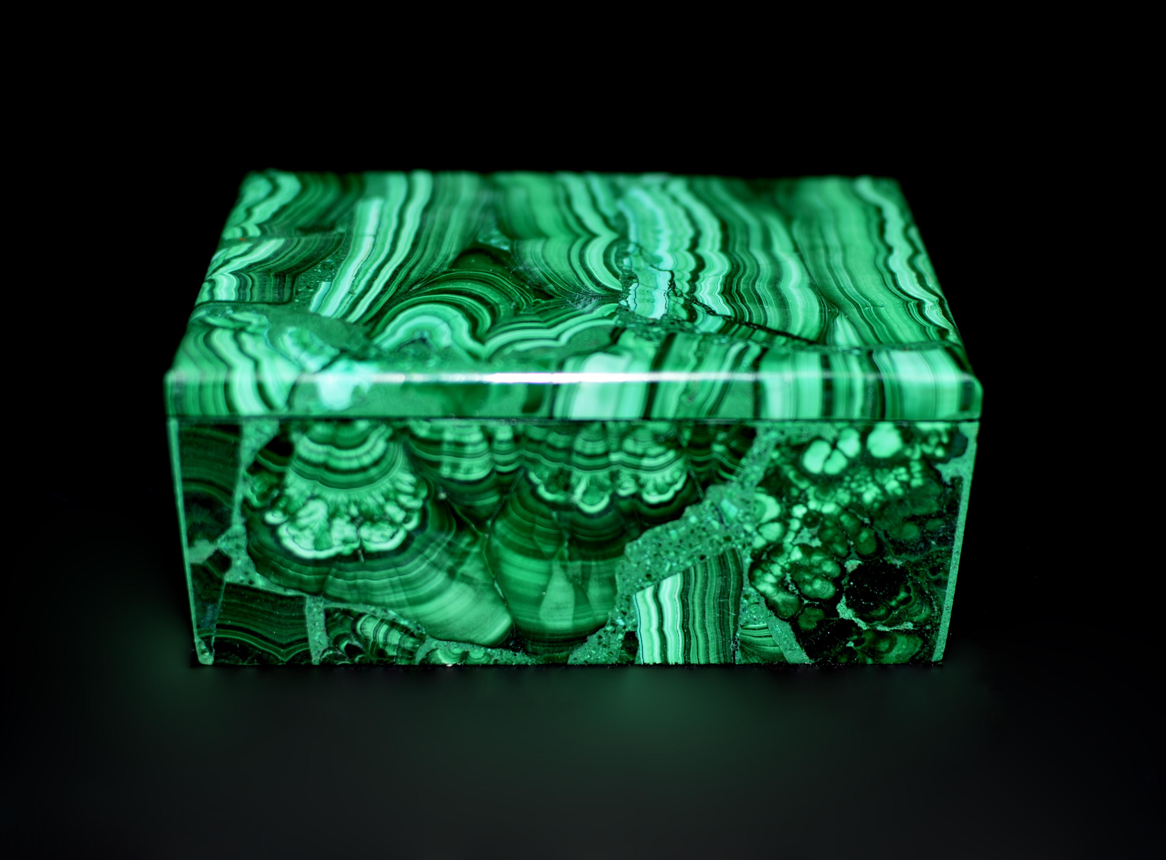 A stunning malachite box with a fantastic stripe pattern resembling images of inside of a cave. This exceptional piece uses carefully selected fine grade gemstone malachite in brilliant green, displaying concentric rings, swirls and stripes. Box is