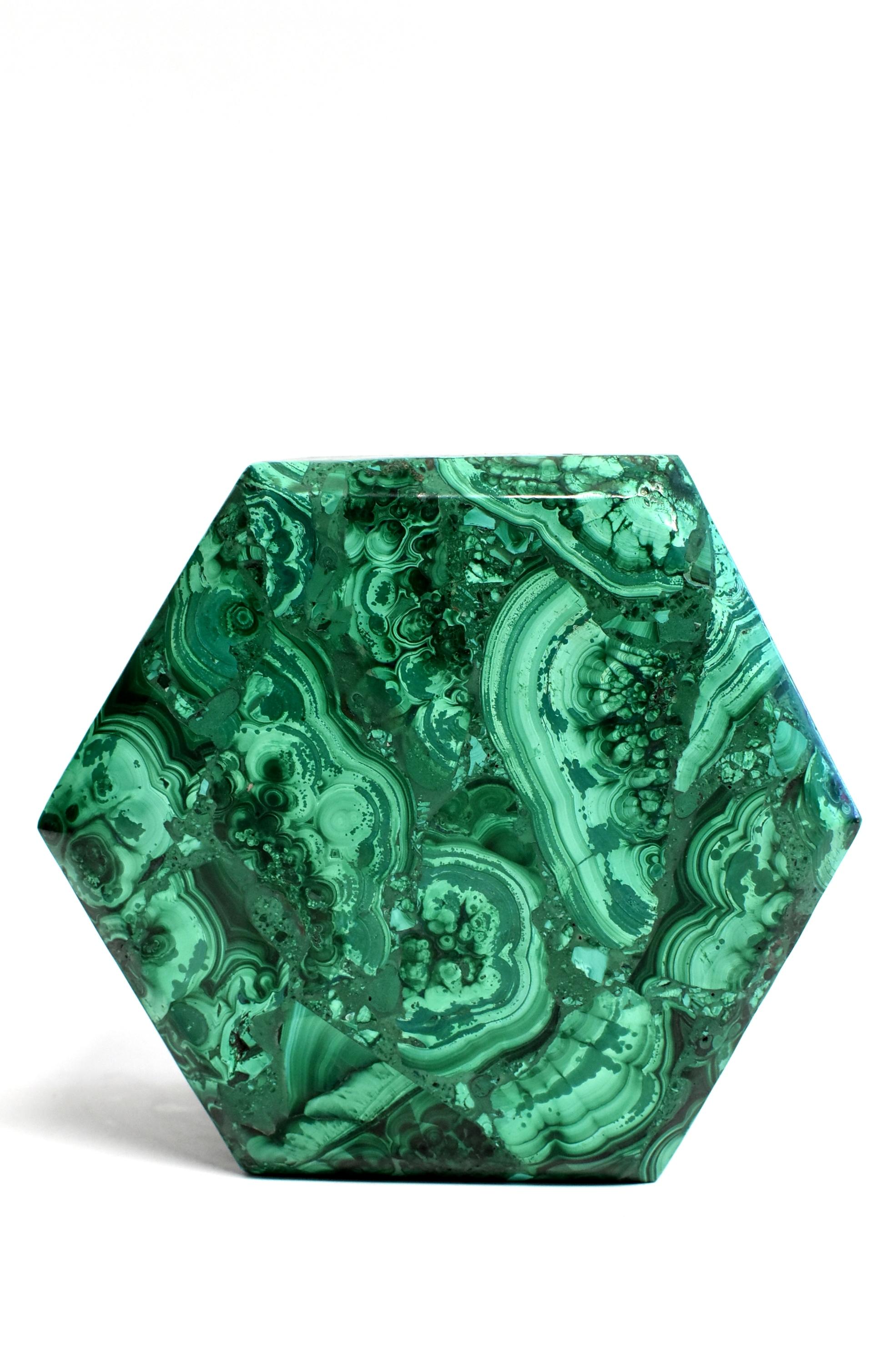A stunning, all natural 2.76 lb malachite box. Splendid swirls and patterns, this remarkable pieces adds a luxurious and sophisticated touch to your home. Unique octagon shape and full slabs of malachite. Malachite is a stone of transformation,
