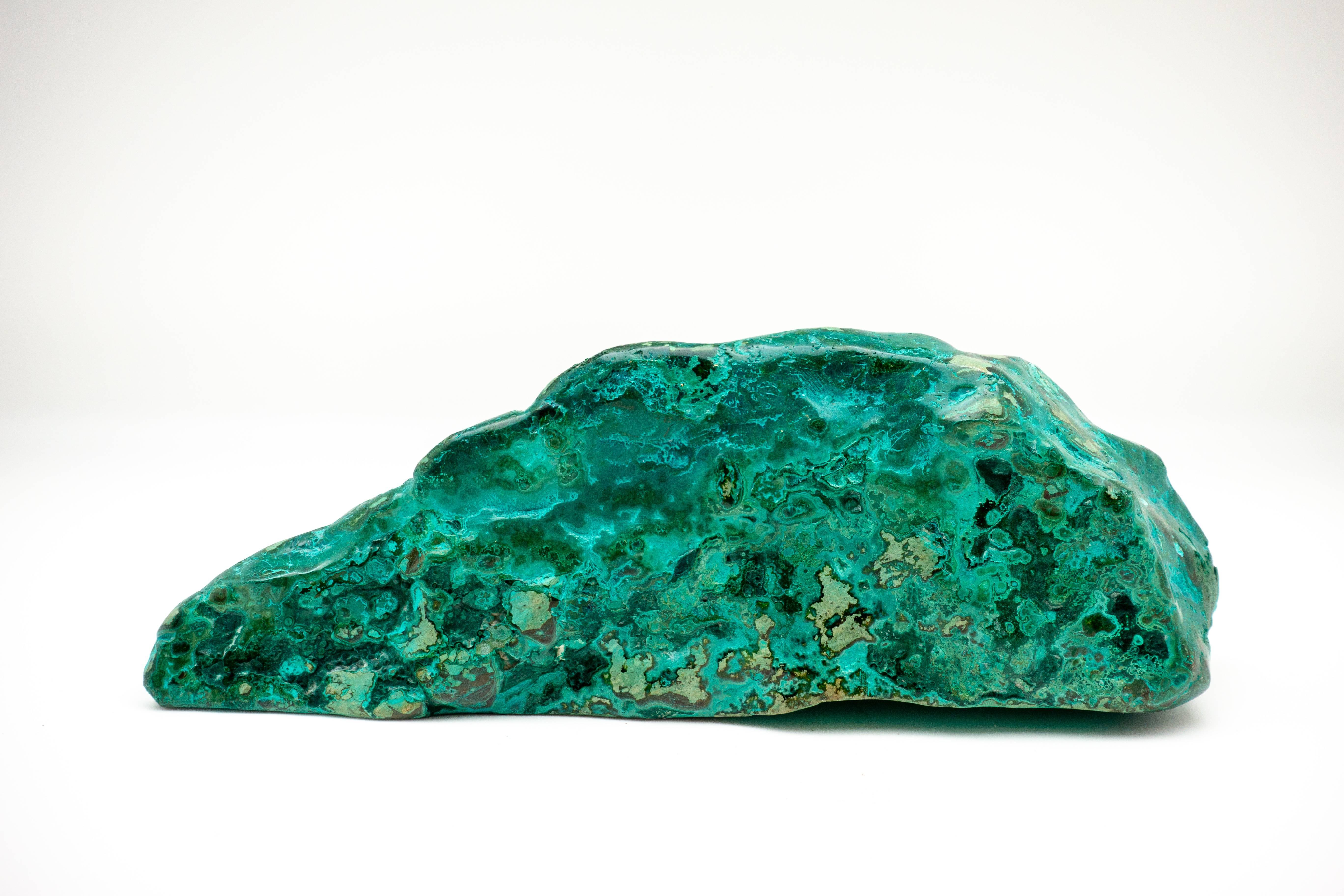 Richly marbled chrysocolla-malachite specimen with a vibrant emerald color. The beautiful blue-green of chrysocolla has made it a prized gemstone in ornamental use since antiquity.