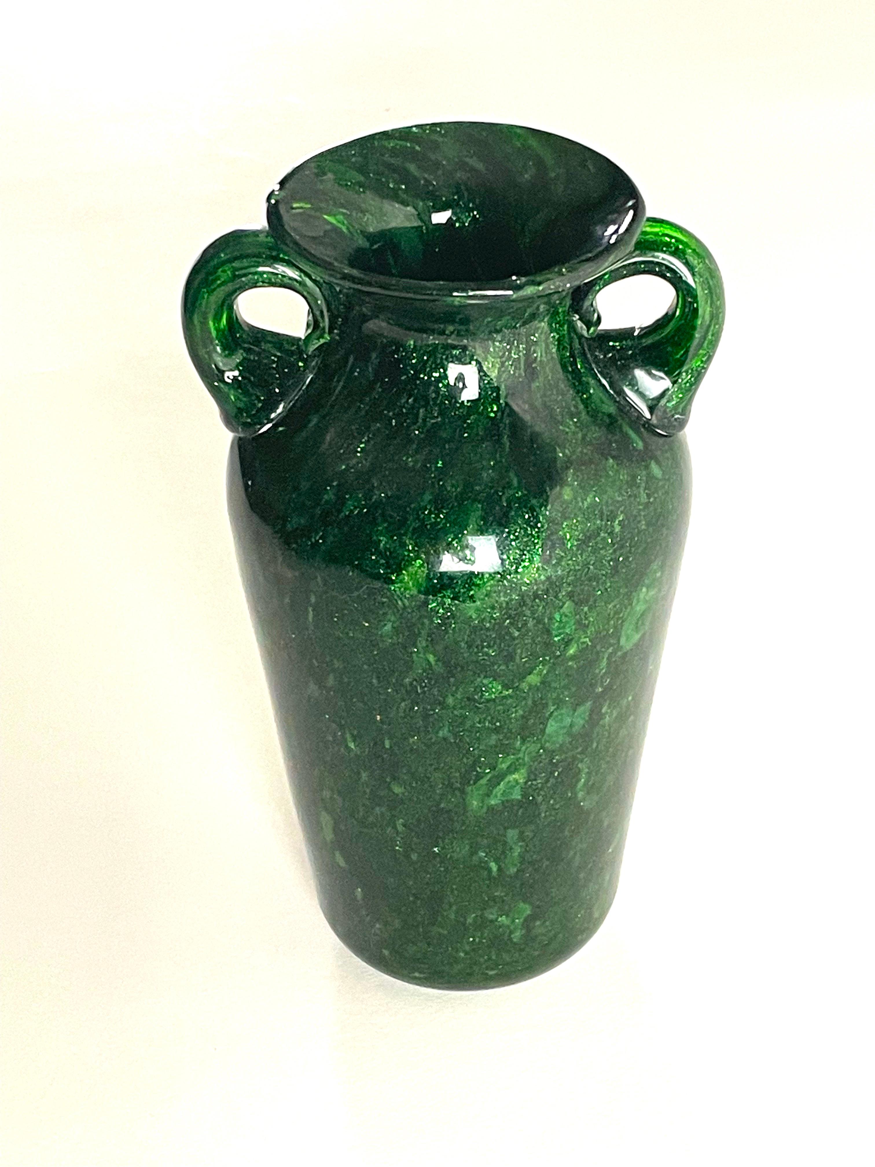 Malachite, an extraordinary creation by Fratelli Toso that pays homage to the iconic Murano glass style. Recalling a typical shape and style, immediately recalling Murano glass making. Its intense green hue radiates opulence and grace, akin to