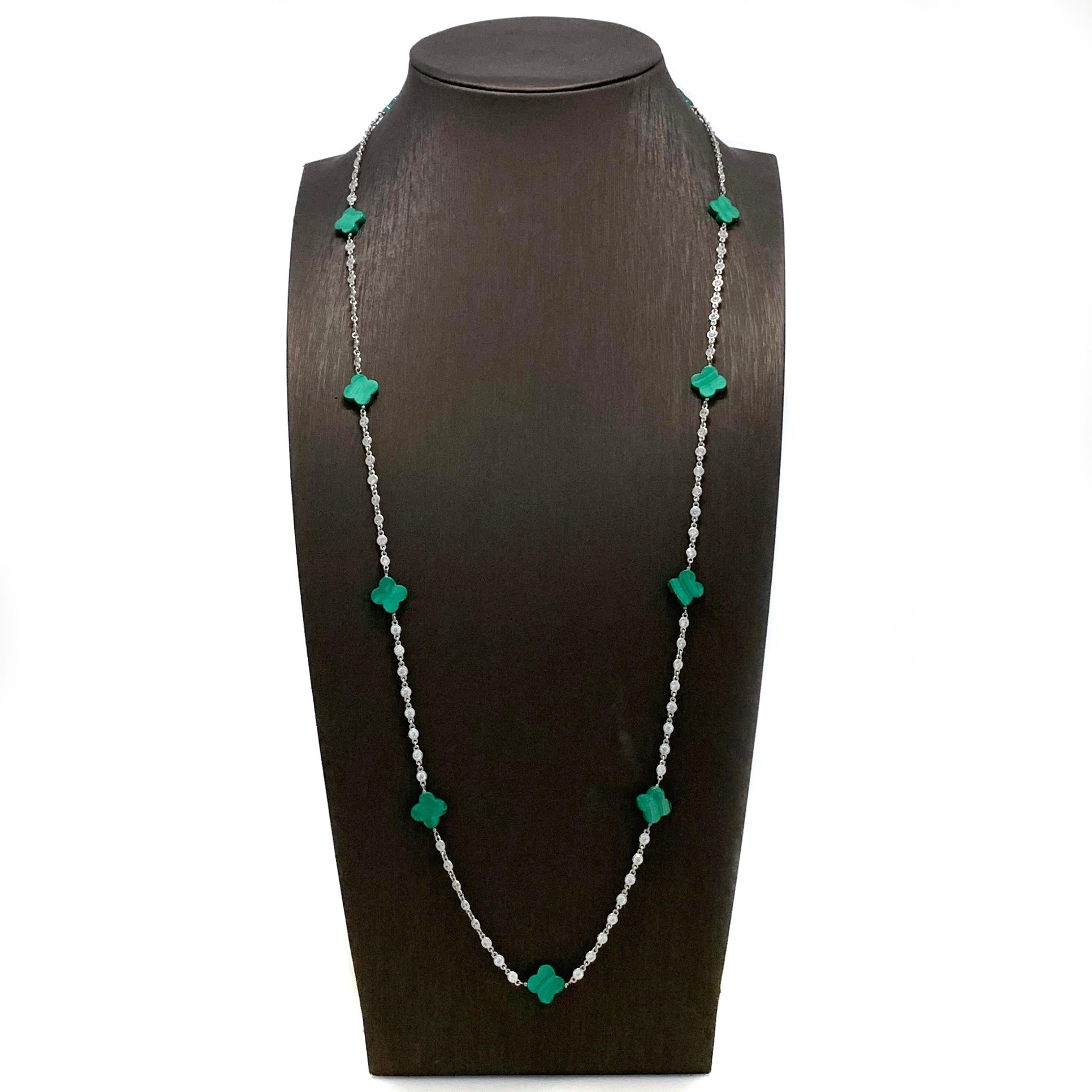 Malachite Clover Sterling Silver Long Station Necklace

The beautiful elegant necklace features 11 pieces of clover-shape malachite and continuous of hand bezel-set faceted faux diamond CZ (0.10ct size each - 9.60ct size total), all wire-wrapped and
