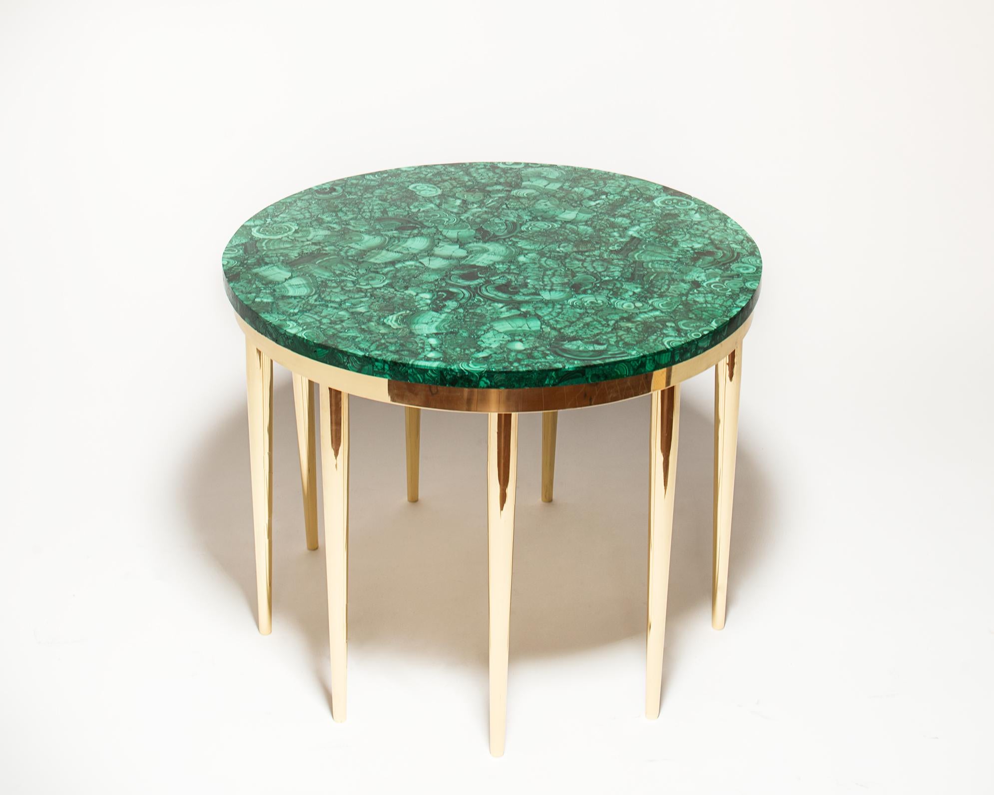 Coffee table with circular top in Malachite and with nine brass legs designed by Studio Superego for Superego Editions, in 2018. Unique piece.

Biography
Superego Editions were born in 2006, performing a constant activity of research in decorative