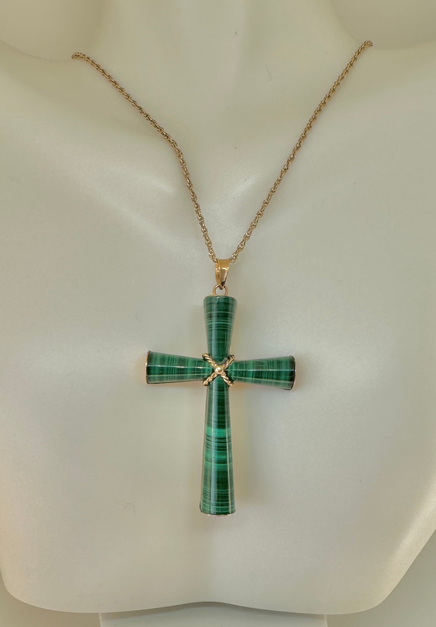 This is an absolutely exquisite Malachite Cross Pendant in 14 Karat Yellow Gold from the estate of Hollywood Legend Mary Lou Daves.  Ms. Daves' jewelry exemplified her exquisite taste.  Her jewels were unique, dramatic and elegant.  The dramatic