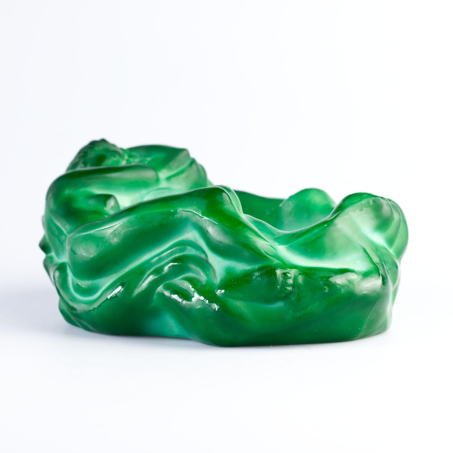 Collectible Art Deco ashtray by Frantisek Halama from Zelezny Brod – Czechoslovakia c. 1930's.

In shape of nude sleeping female. Pattern number 1944/32011.

Beautiful malachite glass, blown in form, hand cut and satined.
