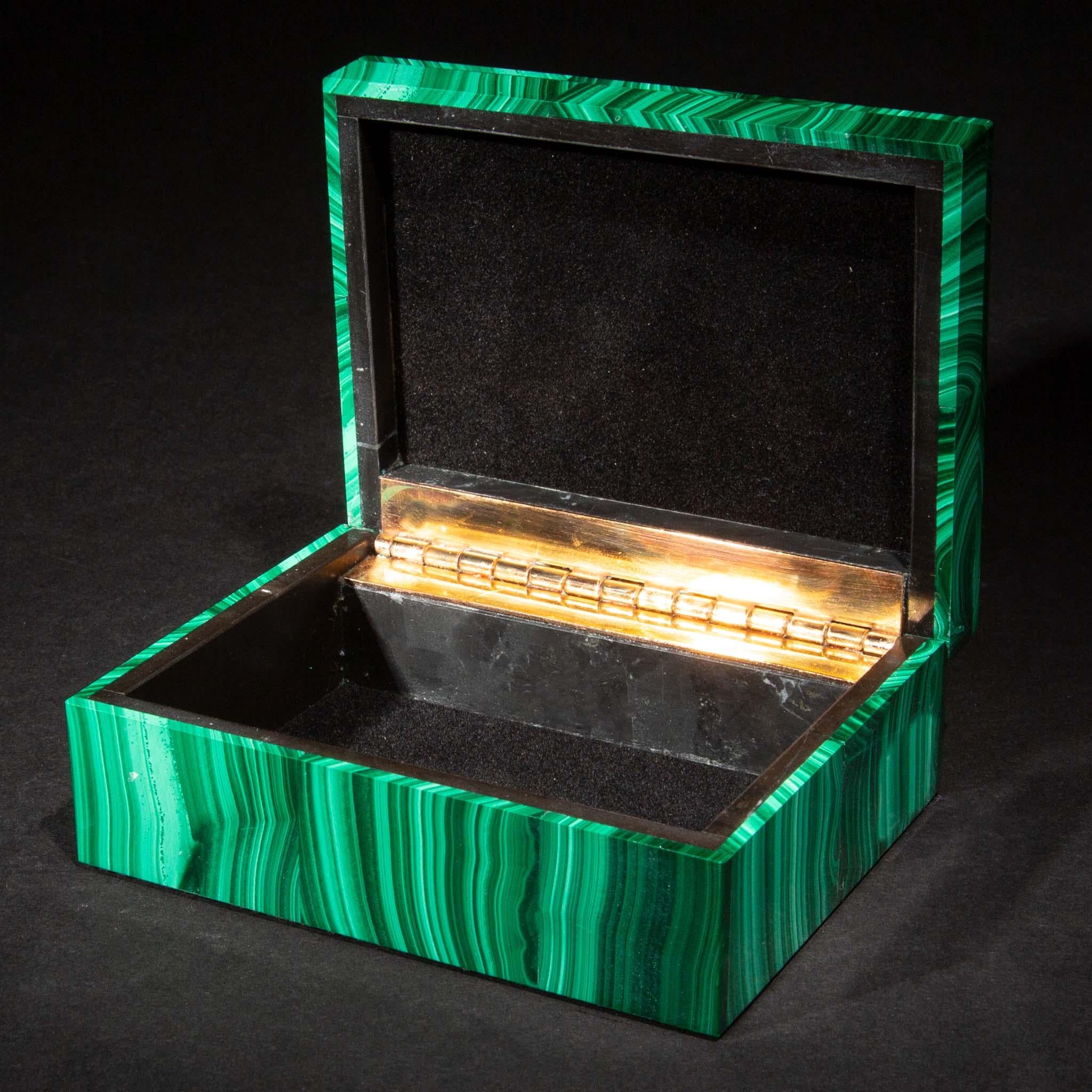 Decorative malachite box. The malachite for these boxes was sourced from the Congo, where the finest quality of this mineral is currently found. Malachite from the 18th and 19th century was also sourced from Russia. Boxes, such as this, were