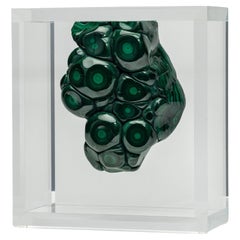 Malachite in free form mounted in original design acrylic base