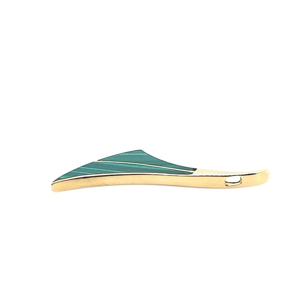 18 Karat Yellow Gold Slide Pendant Featuring Carved Malachite Inlay. 1.5 Inches Long. Finished Weight is 2.4 Grams. 
