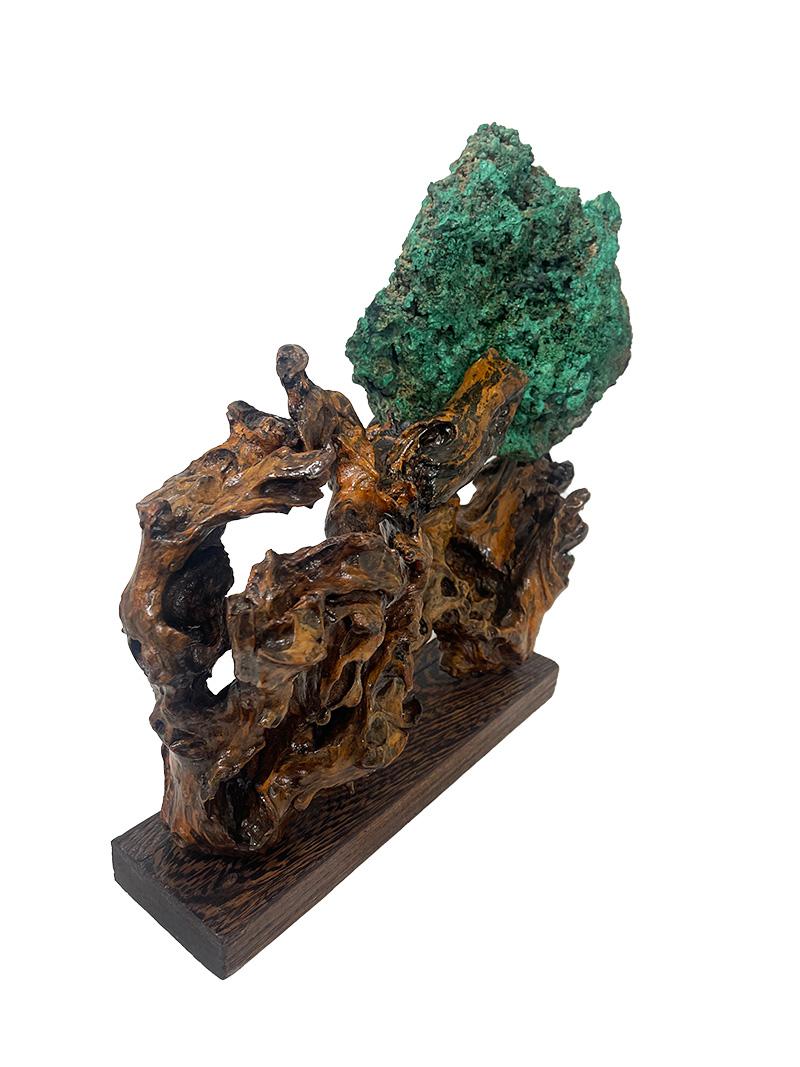 Malachite natural specimen sculpture

A large natural malachite specimen on a cypress wood base. Cypress wood is softwood and not heavy. The beautifully shaped piece of malachite is loose and can be placed on the wooden Cypress roots in a specific