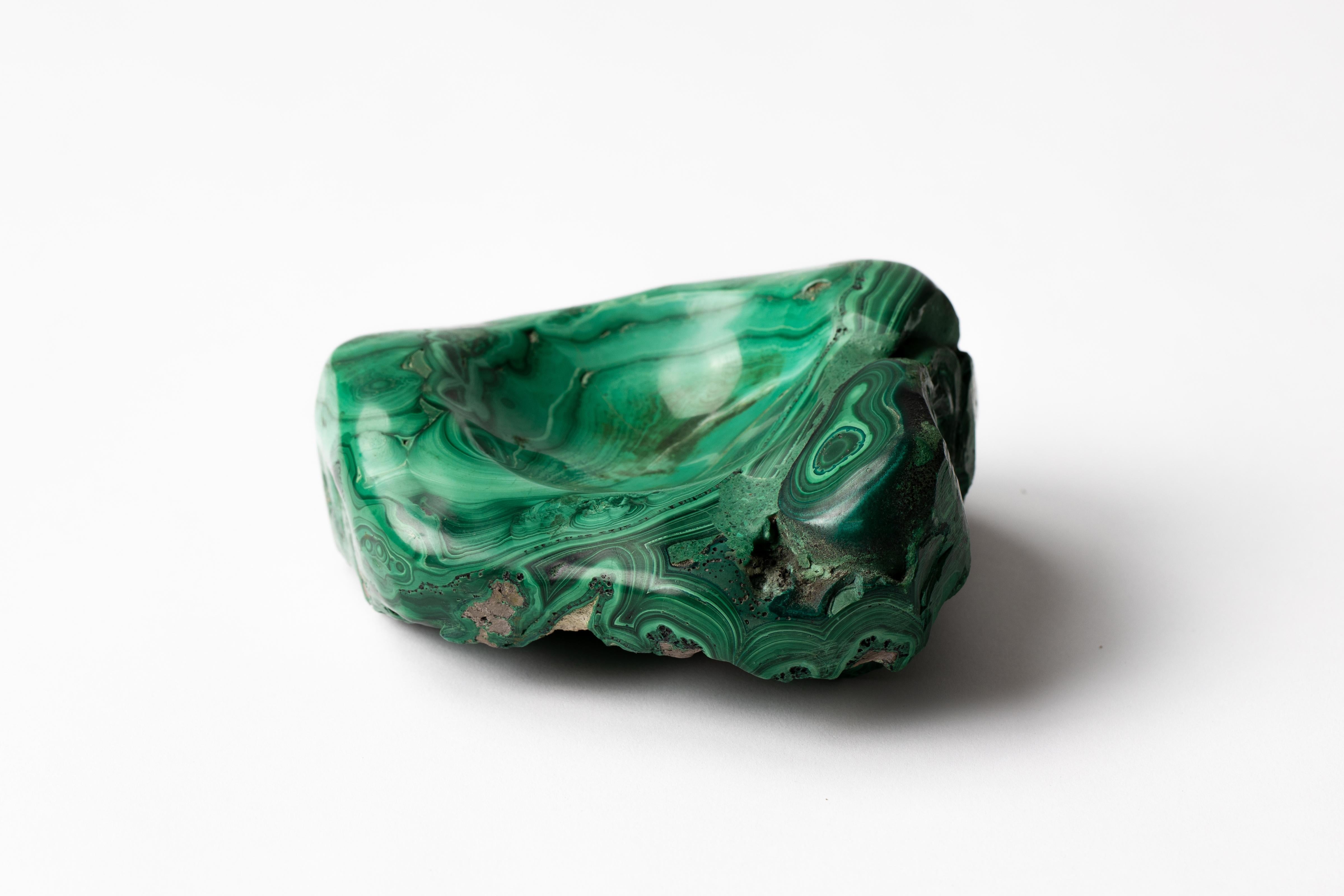 Natural malachite stone specimen vide poche tray hand carved at center.
May be used as a decorative object or used as a paperweight to brighten ones desk.
Beautiful includes crystal forms on bottom, as pictured.
