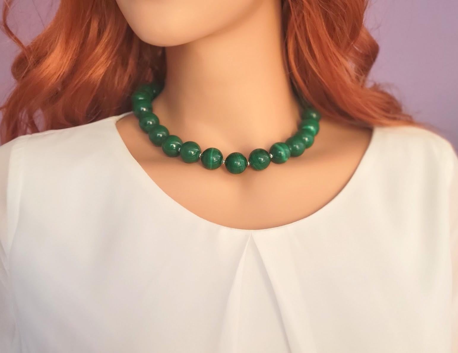 The length of the necklace is 18 inches (45.7 cm). The large size of the smooth round beads is 16 mm.
The color of the beads varies from deep dark green to light green shades. In addition, the color palette within the same stone varies in intensity,