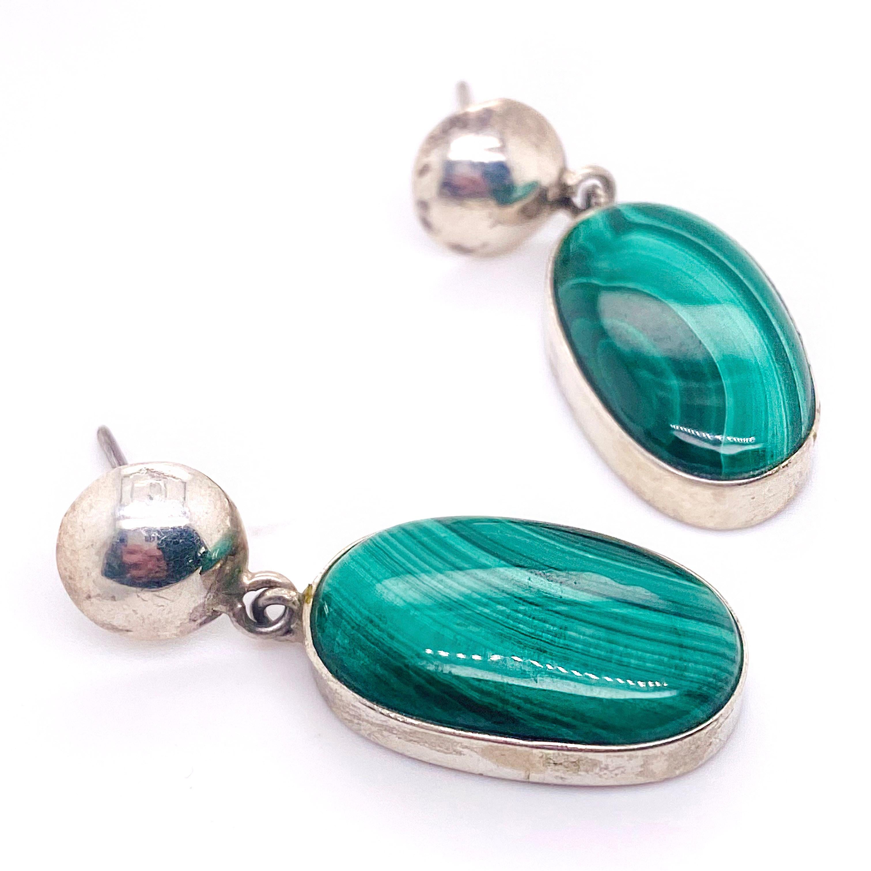 The details for these gorgeous earrings are listed below:
1 Set
Metal Quality: Sterling Silver
Earring Type: Drop
Earring Length: 40 mm / About 1.5 in
Gemstone: Malachite
Gemstone Number: 2
Gemstone Shape: Oval
Gemstone Color: Green Swirls
Gemstone