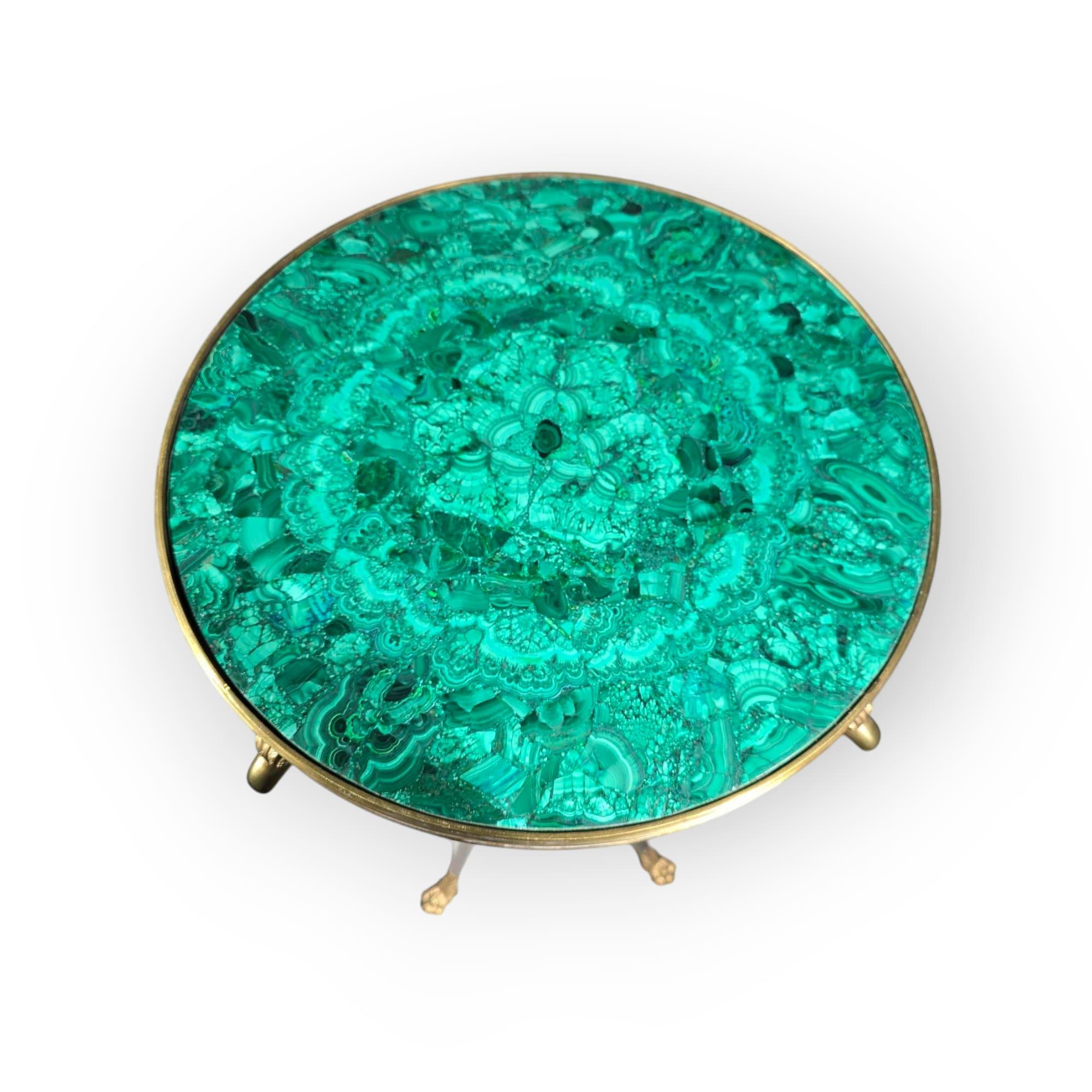 Elegant mid-20th-century malachite pedestal featuring a solid steel base with gilded bronze accents. The rich green malachite surface displays natural veining, characteristic of high-quality specimens. The combination of metallic elements and