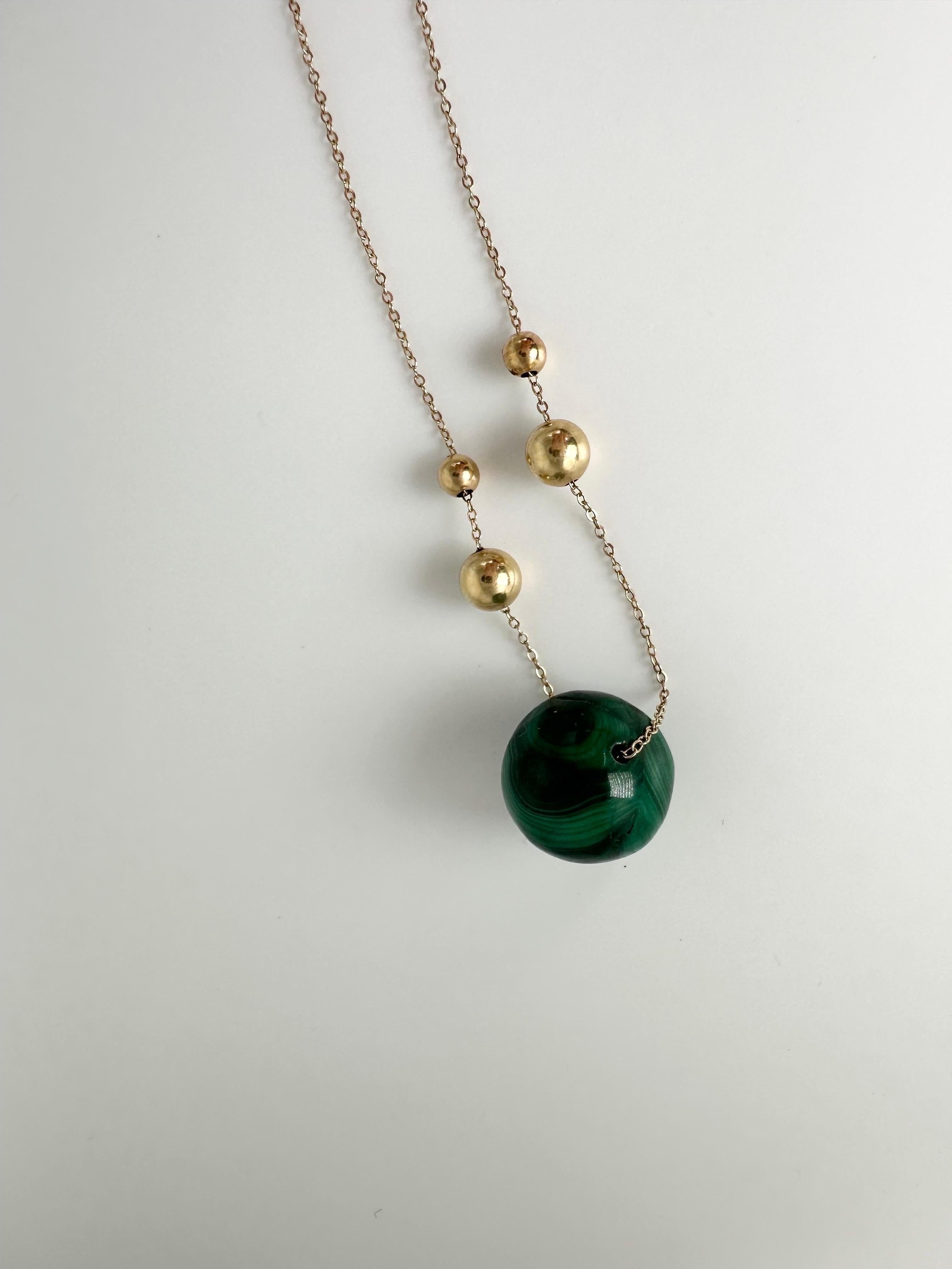 Malachite round pendant necklace in 14KT yellow gold, custom piece with unique character!

GOLD: 14KT gold
Grams:13.48
Malachite: Natural 18mm
15