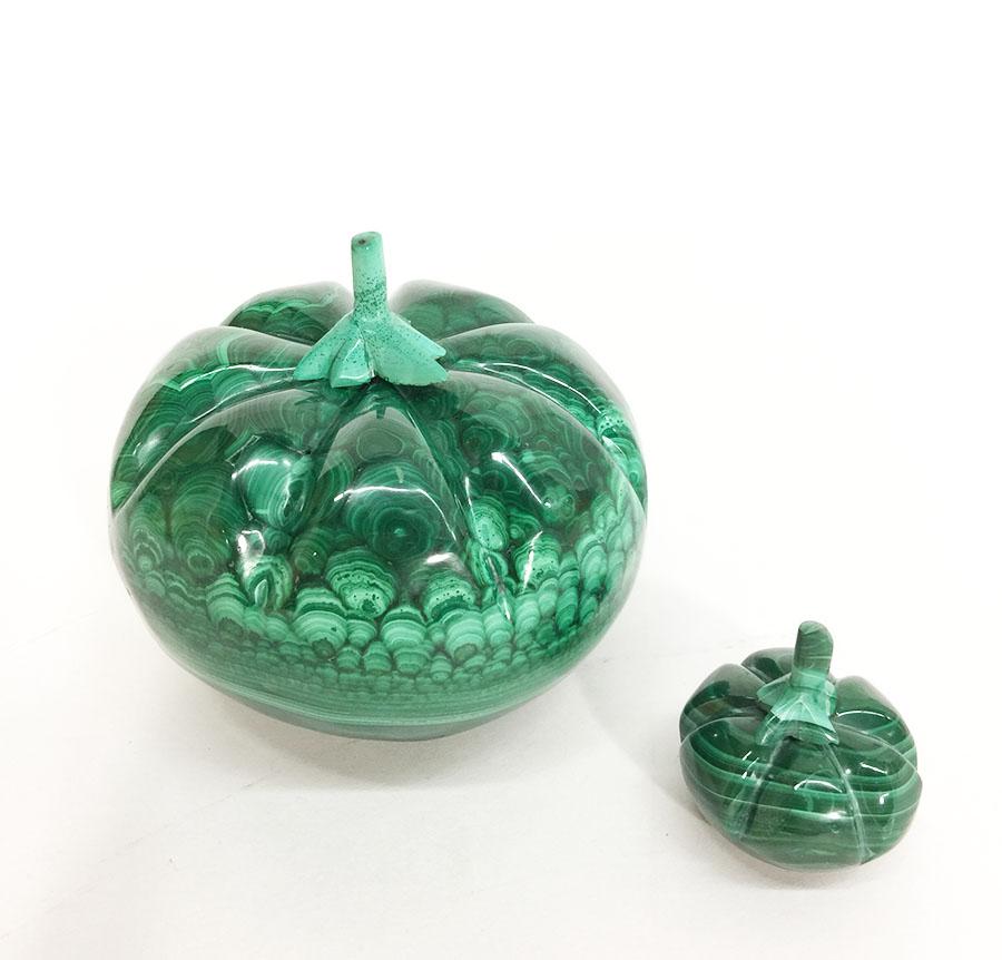Malachite Pumpkins

Africa, 1970s, handcarved and polished malachite

The measurements are 8,5 cm high and 9,5 cm diagonal
The small one is 4 cm high and 4 cm diagonal
The weight is 1319 gram in total

The large pumpkin has some natural