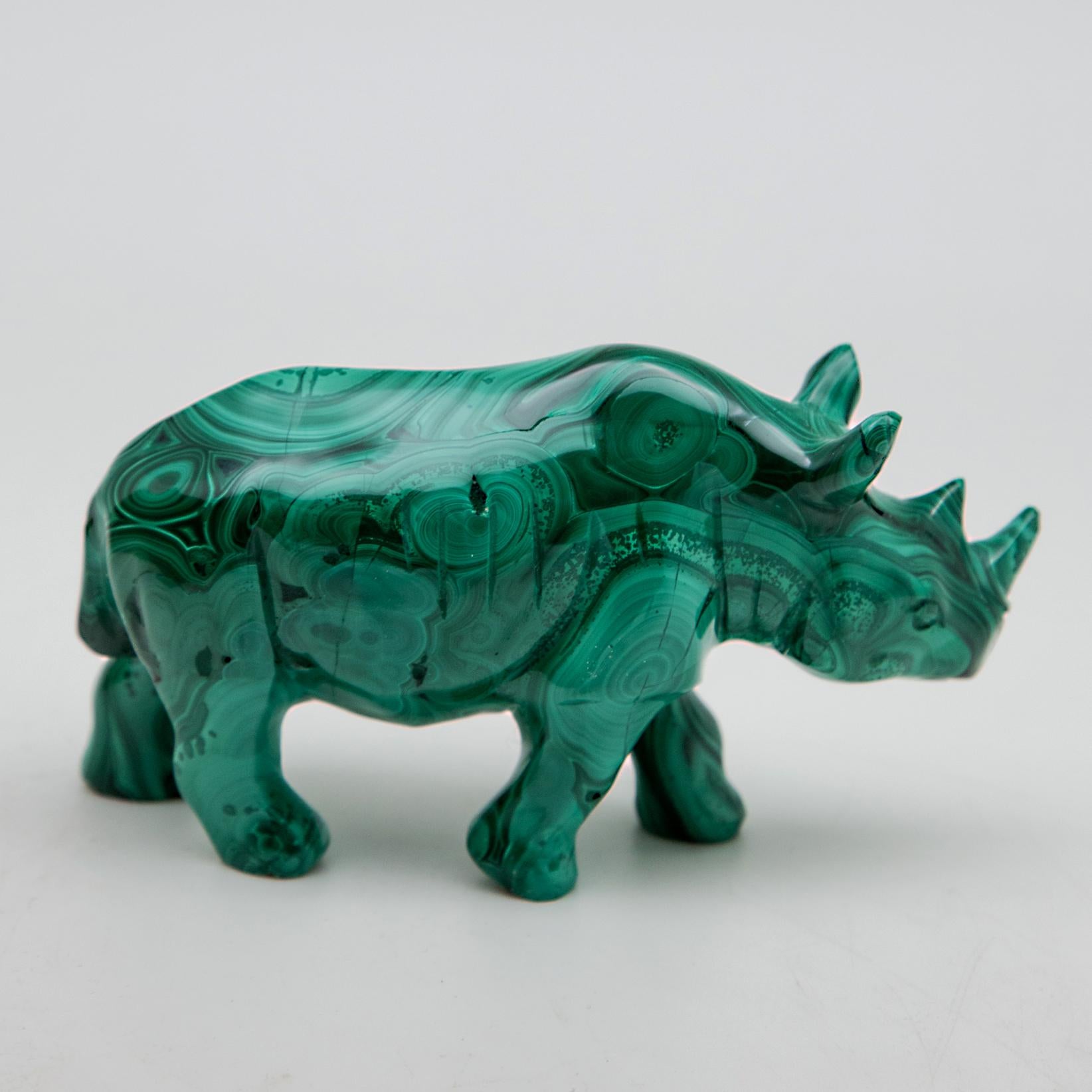 Large carved Malachite rhino. This piece was hand carved in India out of one solid piece of malachite from the Congo. Malachite, known as the 