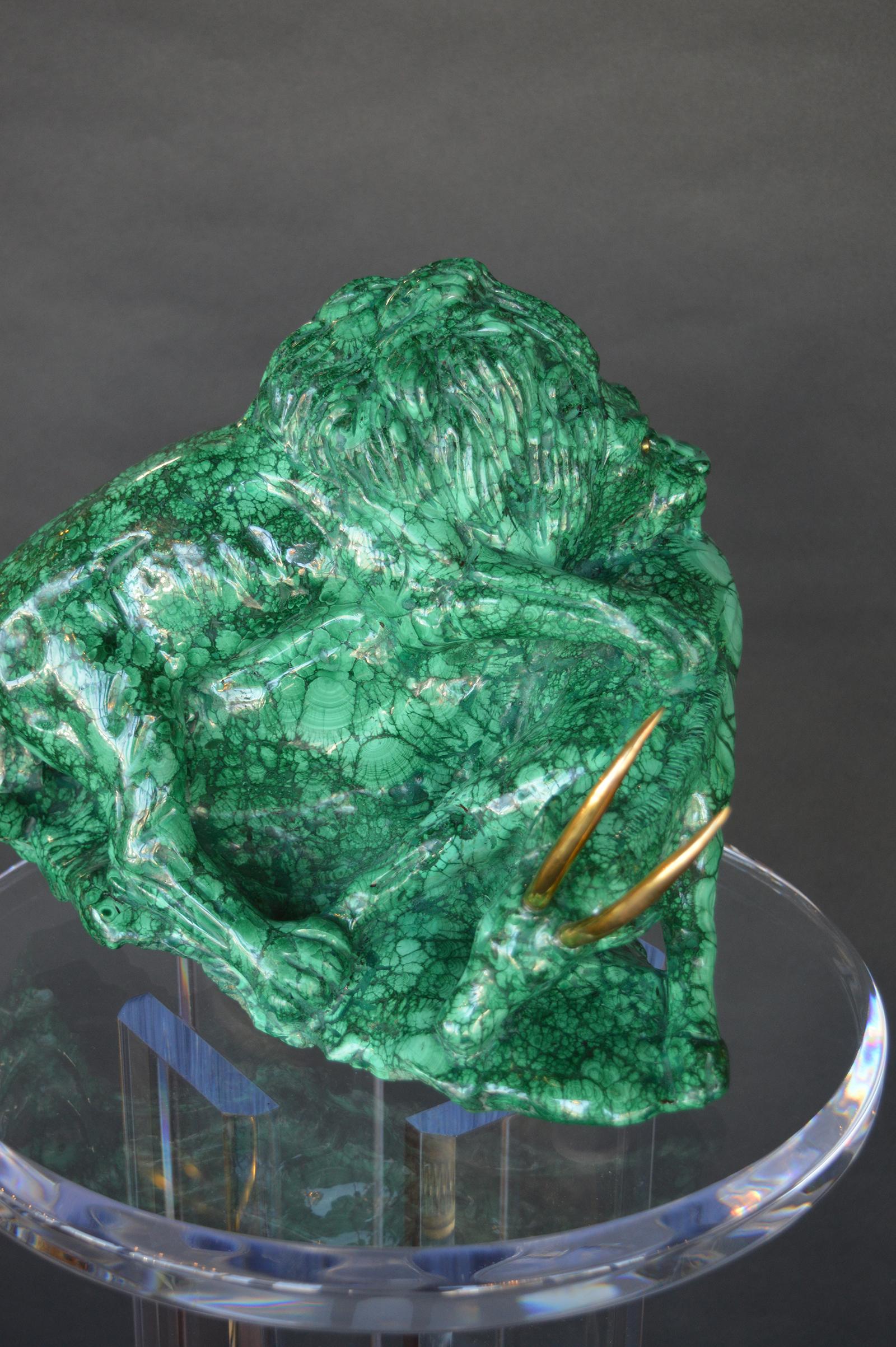 Malachite sculpture of a Lion hunting a gazelle. Lions eyes are made of bronze as are the gazelles horns.
Pedestal Measures: 42 inches H x 13 inches D 
Sculpture Measures: 9.5 inches H x 12.5 inches D.