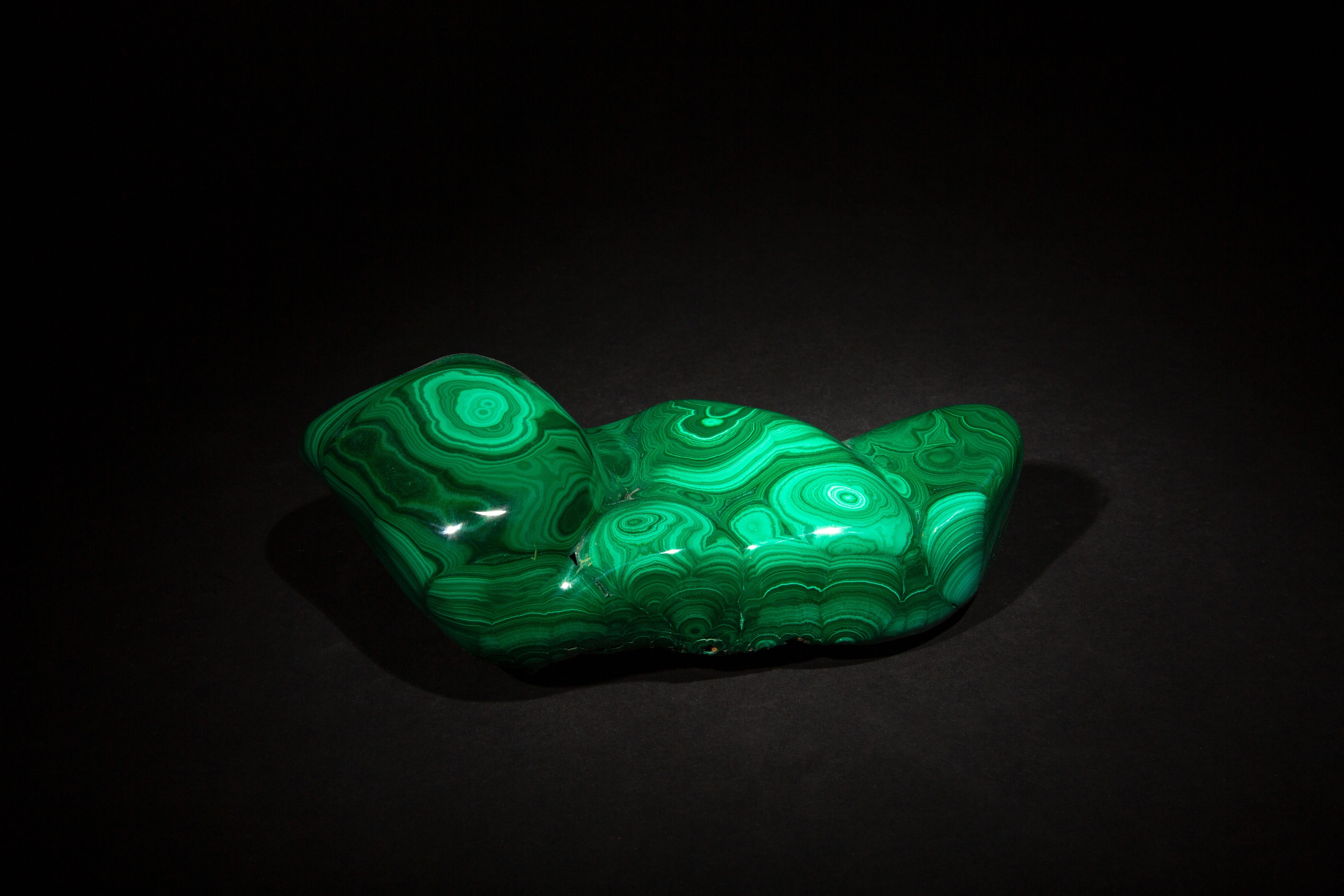 This exquisite malachite specimen, measuring 8.5 inches by 4 inches by 3.5 inches, showcases the intricate beauty of nature's artistry. Renowned for its vibrant green hues and unique banded patterns, each piece of malachite is a testament to the