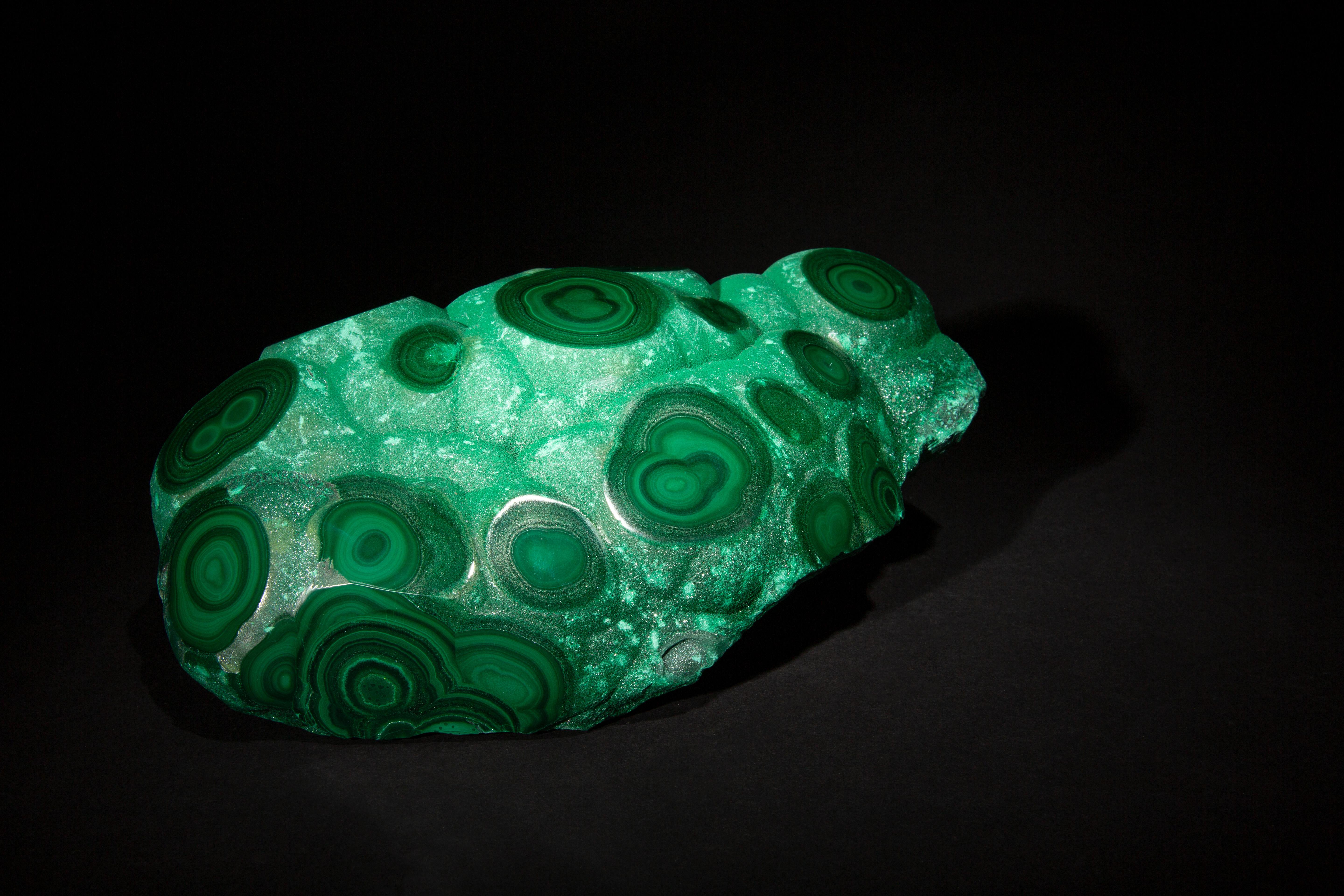 This exquisite malachite specimen, measuring 9 inches by 6 inches by 3.25 inches, showcases the intricate beauty of nature's artistry. Renowned for its vibrant green hues and unique banded patterns, each piece of malachite is a testament to the