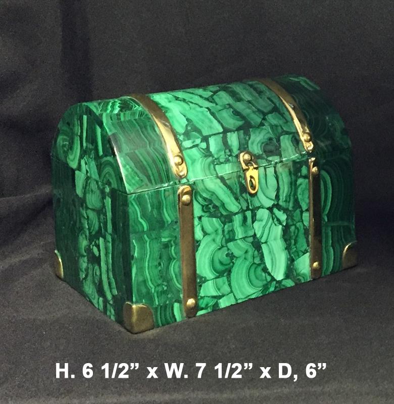 Fabulous brass bonded malachite veneered domed box.
The quality of the malachite is excellent.
Please be informed that the bottom is also malachite veneered and that shows that this is very good quality.