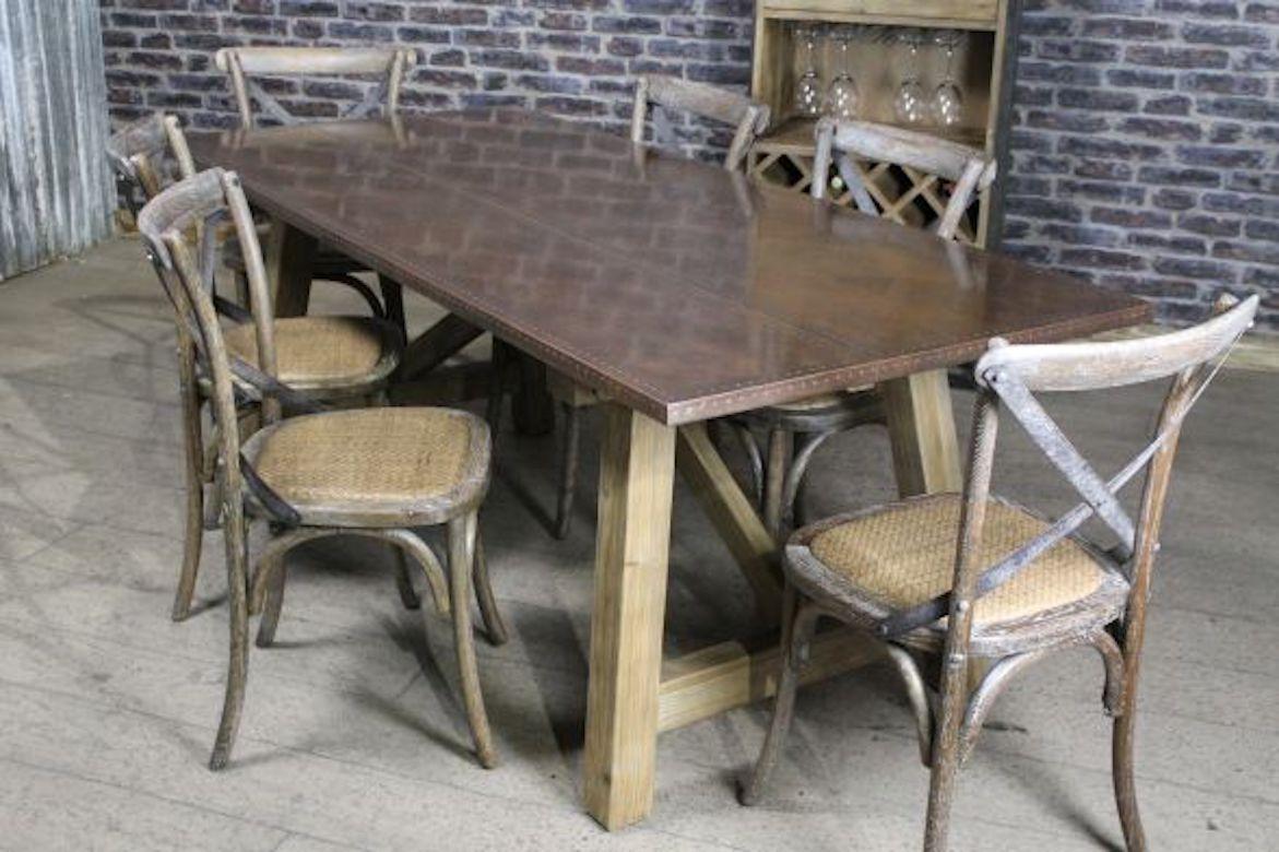 A fine Malaga zinc and copper dining table range, 20th century.

A fantastic addition to our range of kitchen, dining and restaurant furniture, our 'Malaga' copper dining table will add style and ambience to any commercial or residential property.
