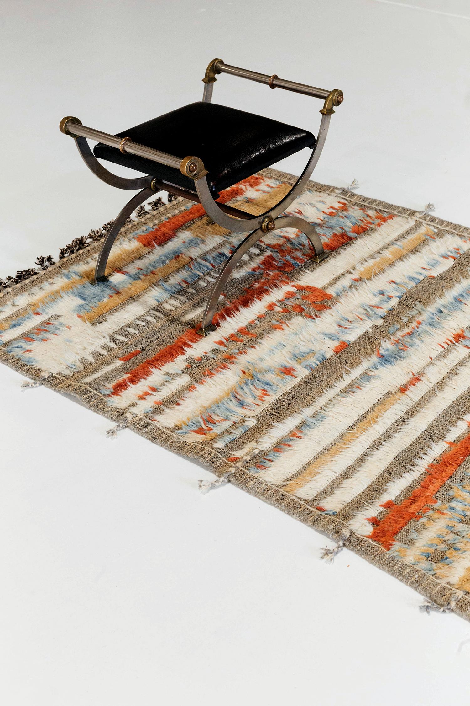 Malaren' is a handwoven luxurious wool rug with timeless embossed detailing. In addition to its perfect natural flat-weave, Malaren has beautiful colorful shags that brings a lustrous texture and contemporary feel to one's space. The Haute Bohemian