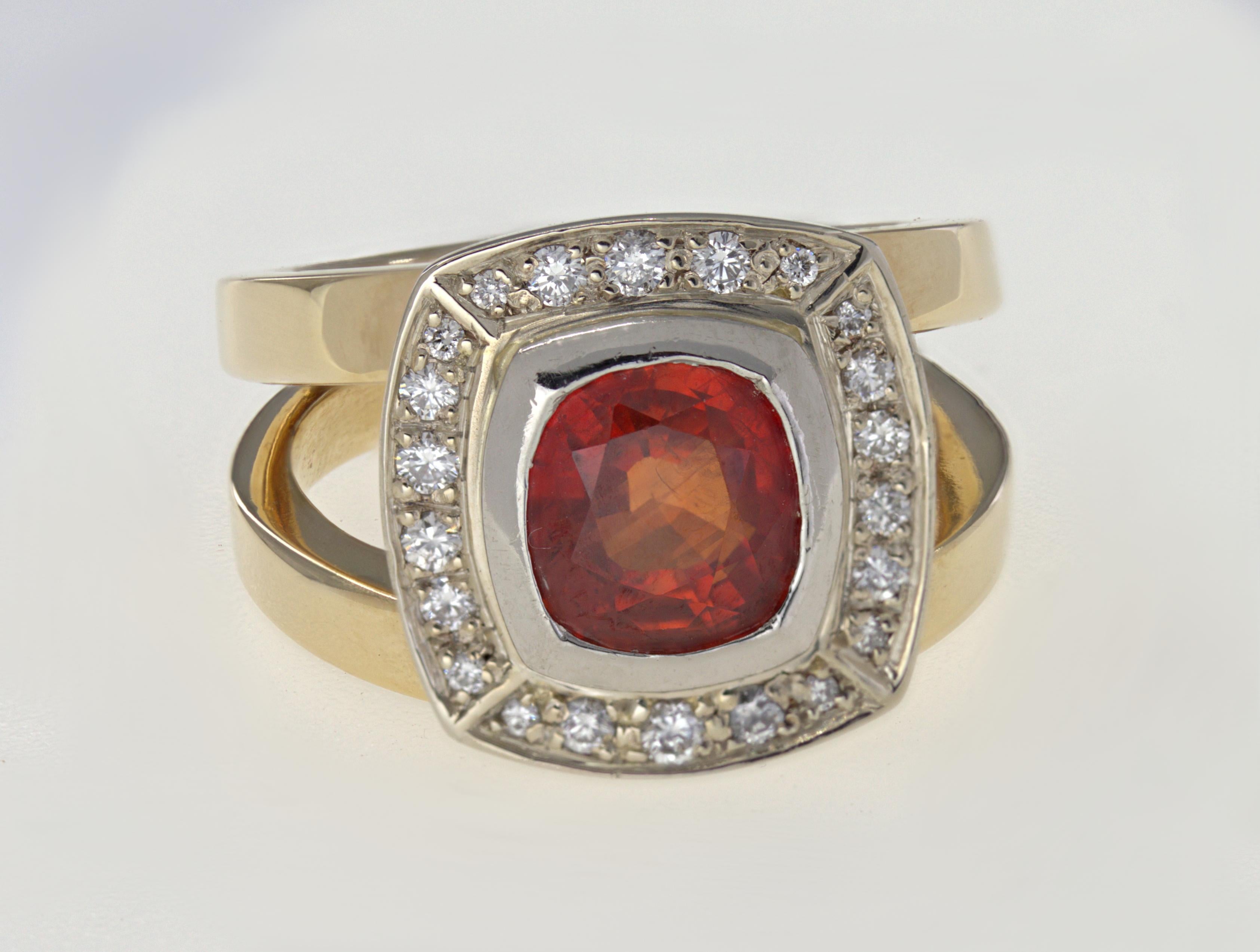 Featuring (1) square cushion-cut Malaya garnet, 2.30 cts. tw., surrounded by (26) full-cut diamonds, 0.40 ct. tw., SI, I-J, set in a palladium top, completed by a 14k yellow gold split shank, mounting, tapering from 11.9 mm to 2.4 mm, size 6.5,