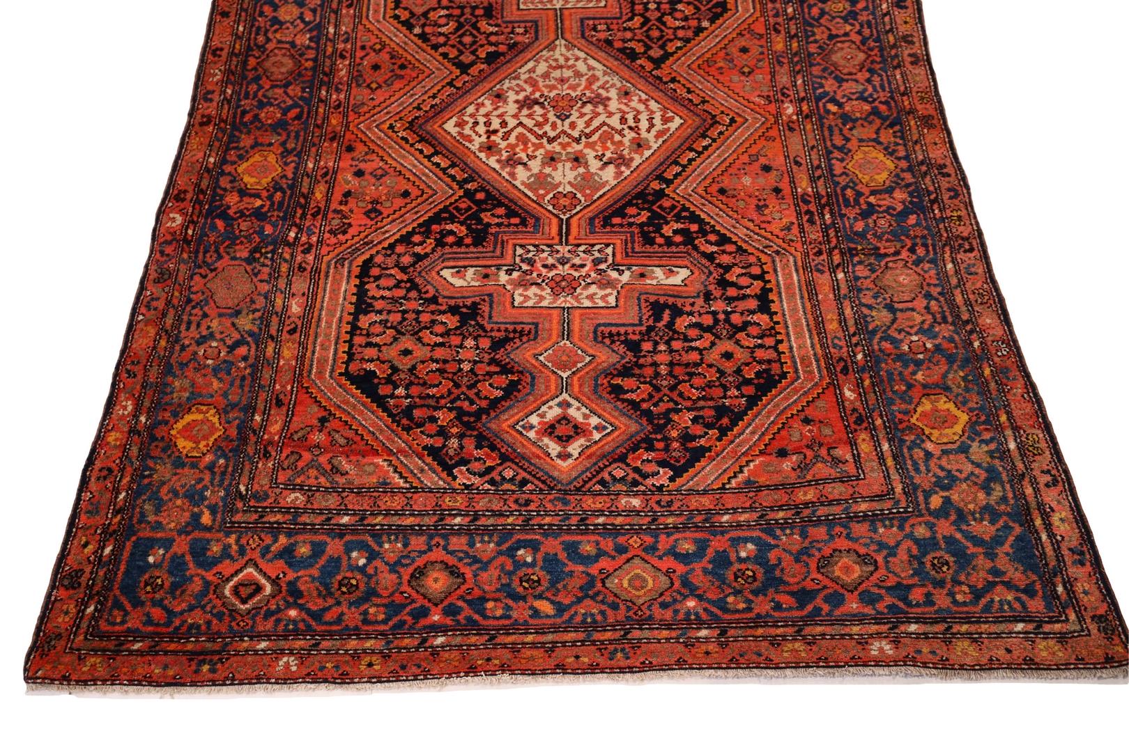 Introducing the magnificent Malayer rug, a true masterpiece that will undoubtedly bring joy and warmth to any home. This rug boasts a rich ruby red hue, which immediately draws the eye in and commands attention. The stunning ivory medallion is the