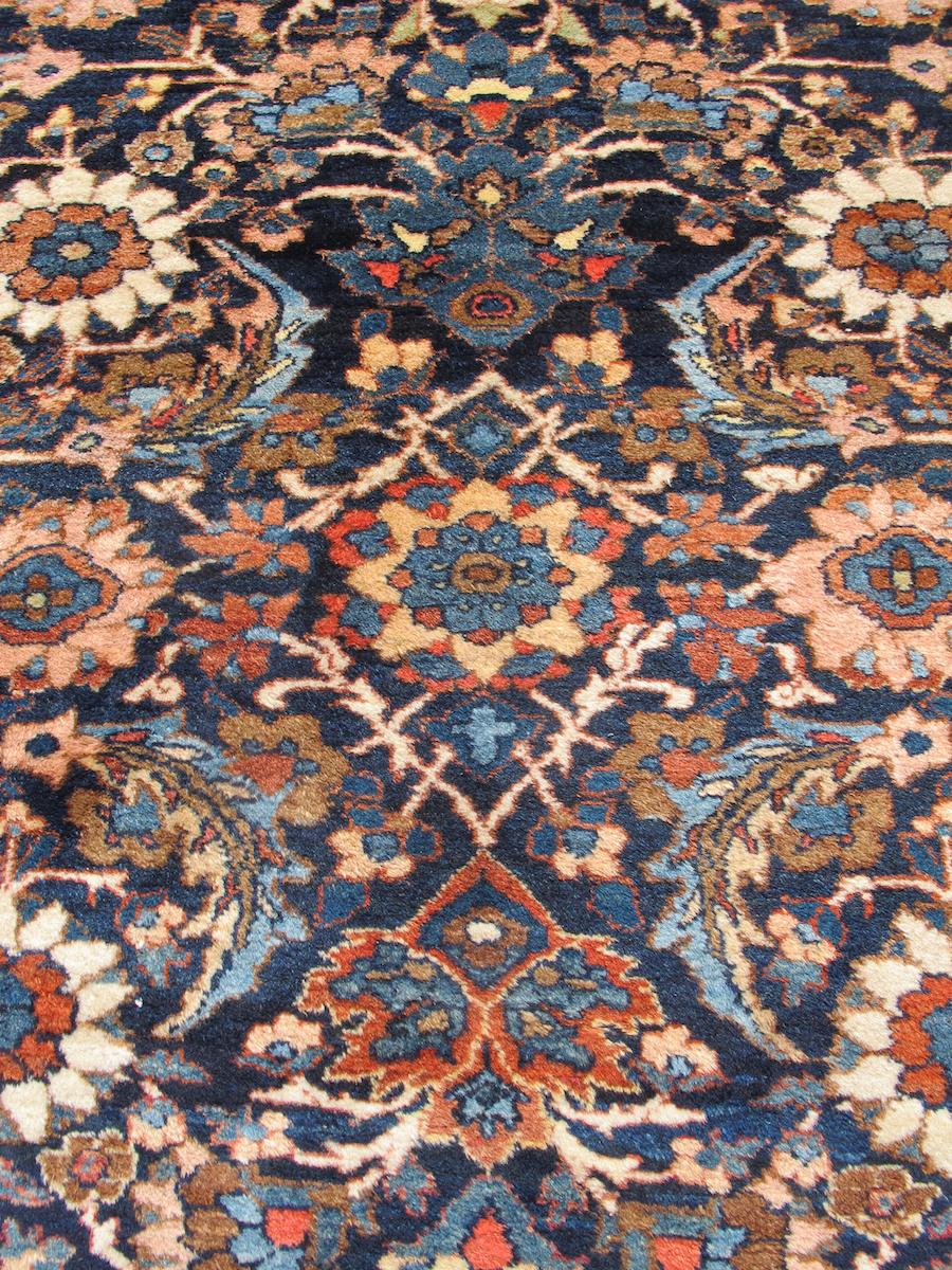 This floral Bibikabad carpet from central Persia provides a creative take on a classic all-over design, the repeat “Herati” pattern. The central rosettes used in this design are typically scaled much smaller with a greater emphasis placed on the