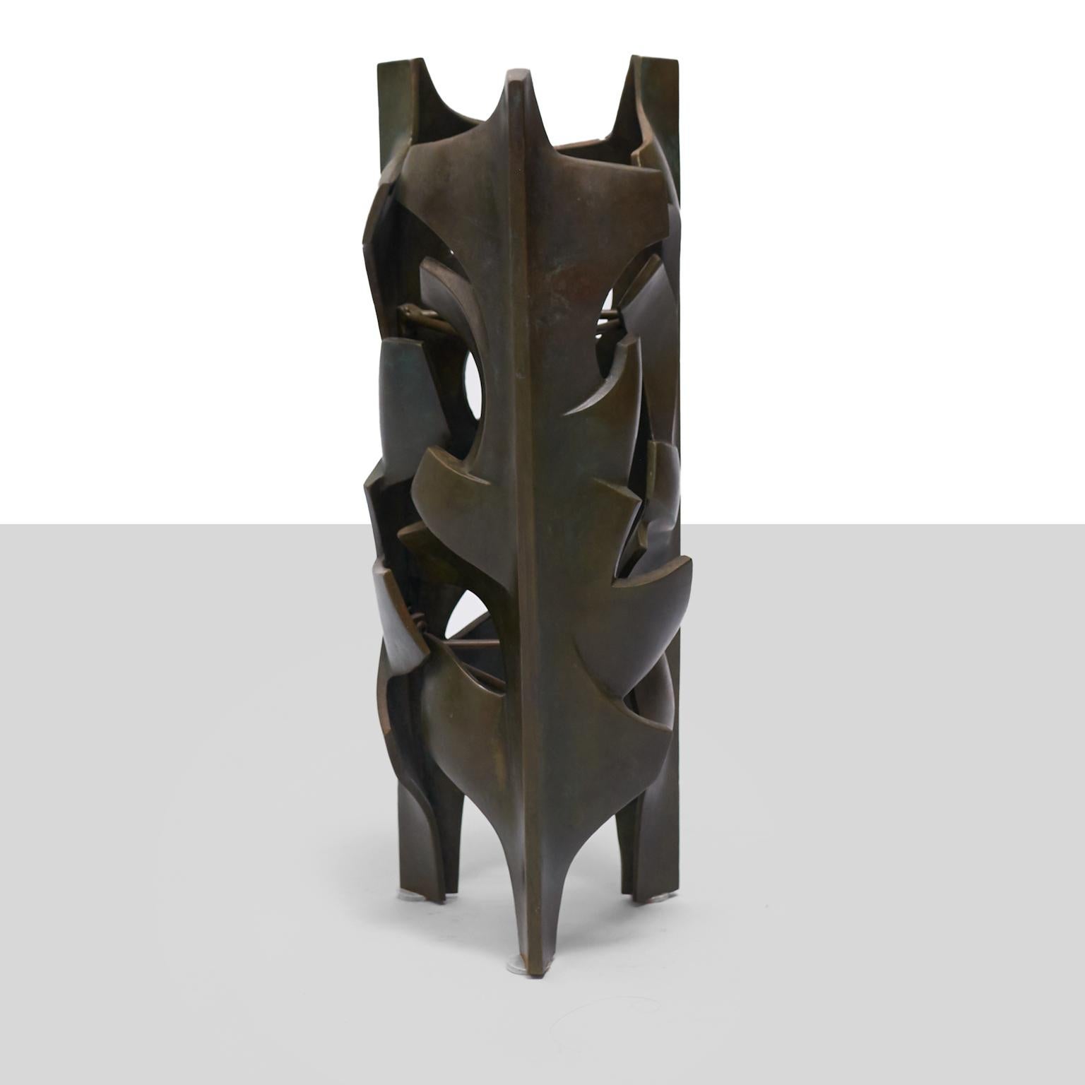 A sculpture or floor sconce of impressionistic leaves. In cast bronze, this piece was directly from the studio of the artist, never having gone into general production.

United States, designed 1962/executed c1980.