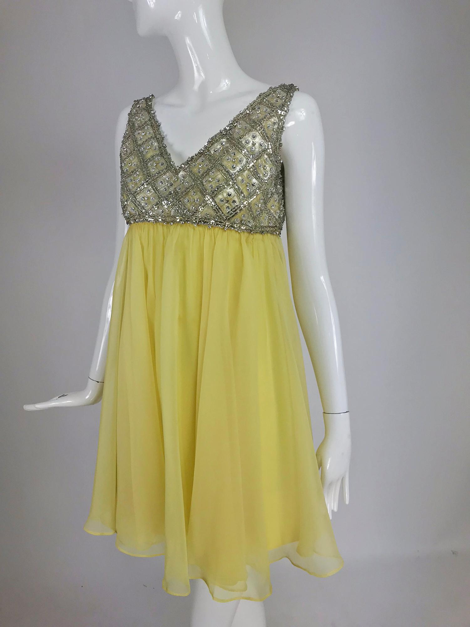 Malcolm Starr baby doll dress in rhinestones and lemon silk chiffon from the 1960s. A dress worthy of Goldie Hawn in her Laugh In days. The bodice is pretty spectacular with a plunge neckline at the front and a bateau neckline at the back. The