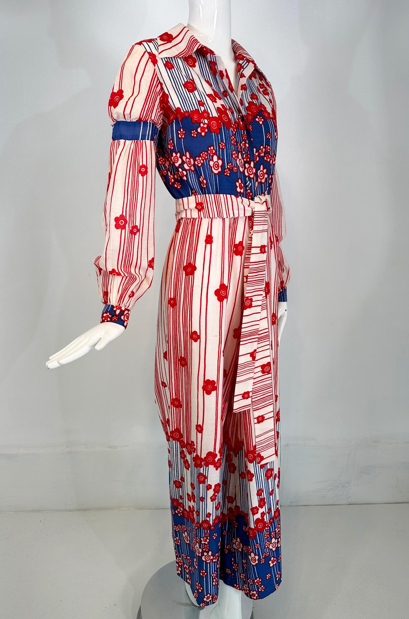Malcolm Starr by Rizkallah red white & blue floral cotton wide leg jumpsuit from the 1960's. Long sleeve, button front bodice with a notched wing collar & self buttons. The long sleeves have a blue set in upper arm band that gives the upper sleeve a