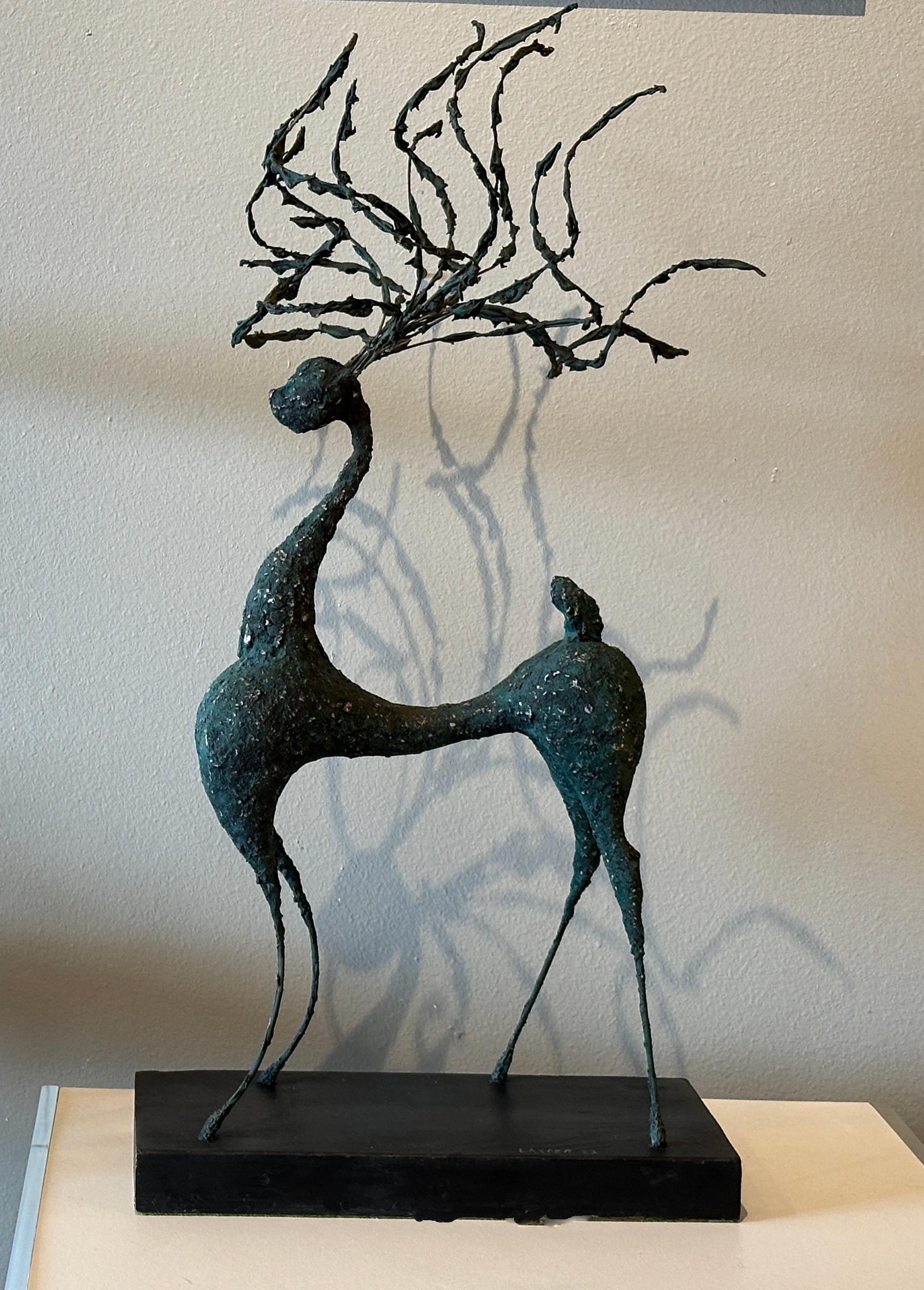 This deer sculpture by Laster, signed and dated 1982, combines formal rigor and power, unfolding an almost devotional space around it

At night with the light the shadows of the sculpture reflecting on the wall amplifies its strength. (see picture)
 