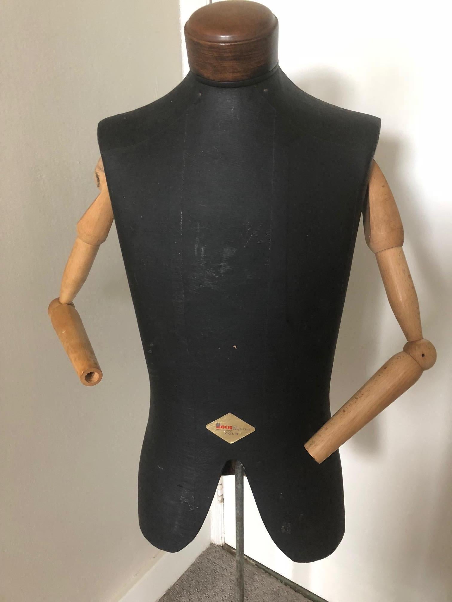 Male model, bust, mannequin, dress form with articulated arms. On original, adjustable ornate brass stand. By Moch Figuren of Koln, Germany, world's oldest mfg of mannequins. Acclaimed sculptors of the human form.

This male bust has articulated
