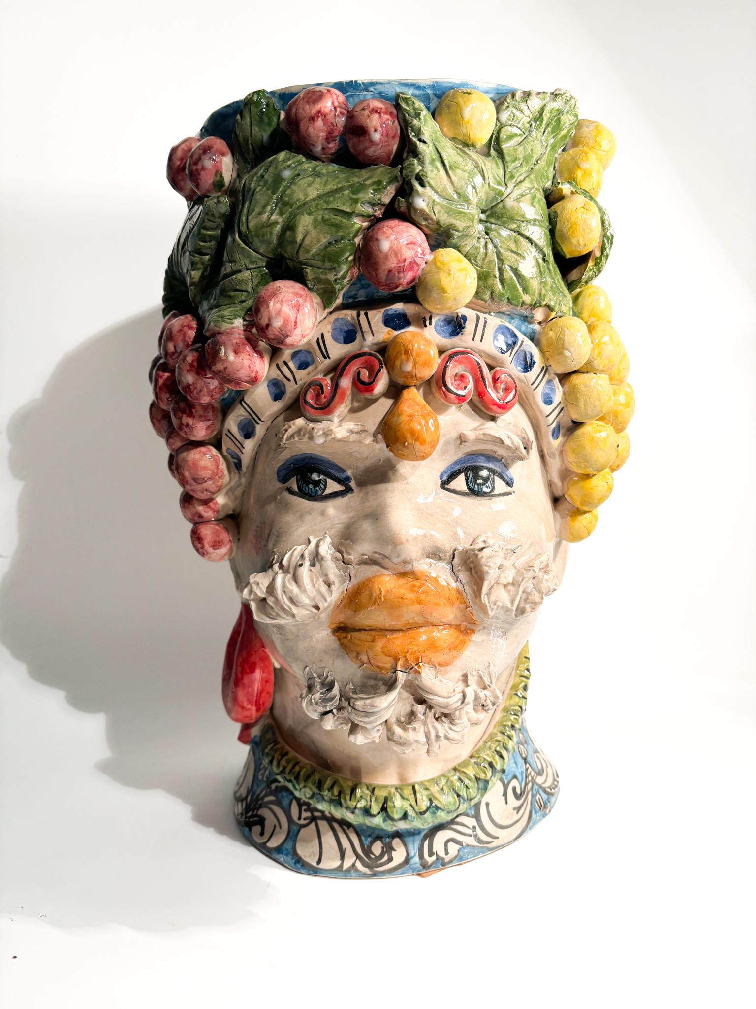 Caltagirone Moor's head of a male figure with vine, made by Ceramiche Germano in the 1990s

Ø 28 cm h 44 cm

Ceramiche Germano is a ceramic company based in Caltagirone, Sicily, Italy. The company was founded in 1967 by Sebastiano Germano and is